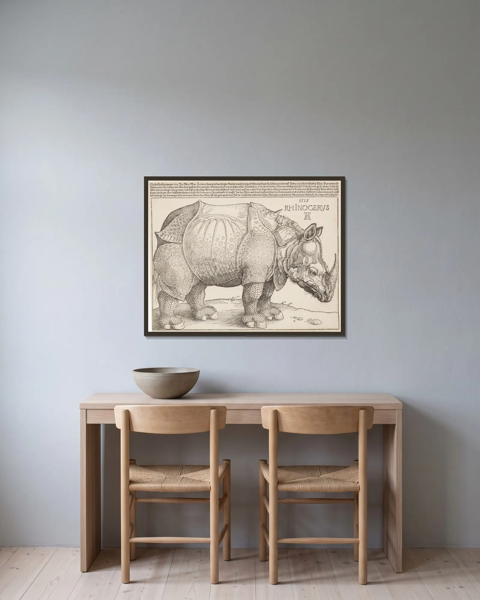 Rhinocerus (Das Rhinozeros) av Albrecht Dürer inramad på en vägg