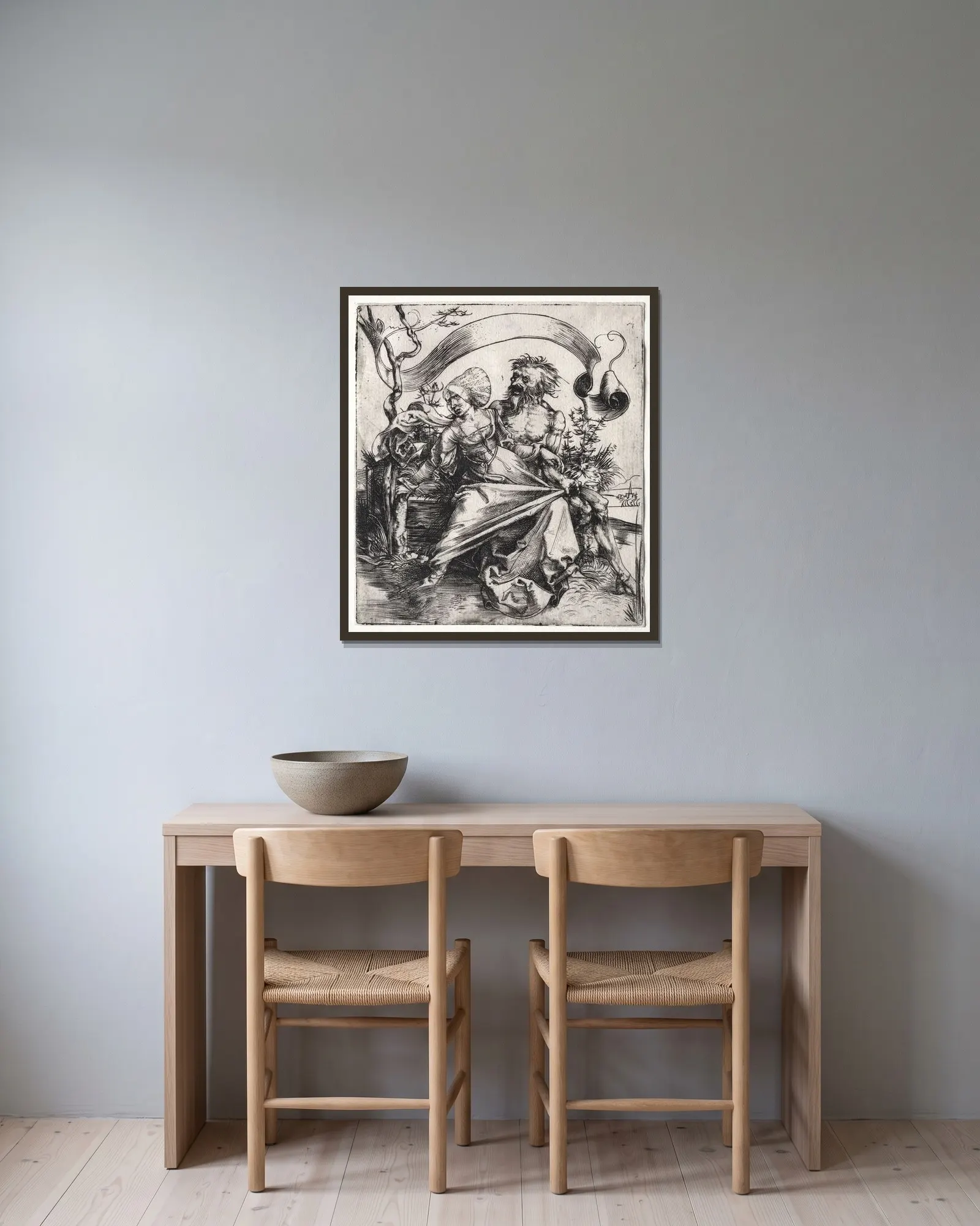 The Ravisher av Albrecht Dürer inramad på en vägg