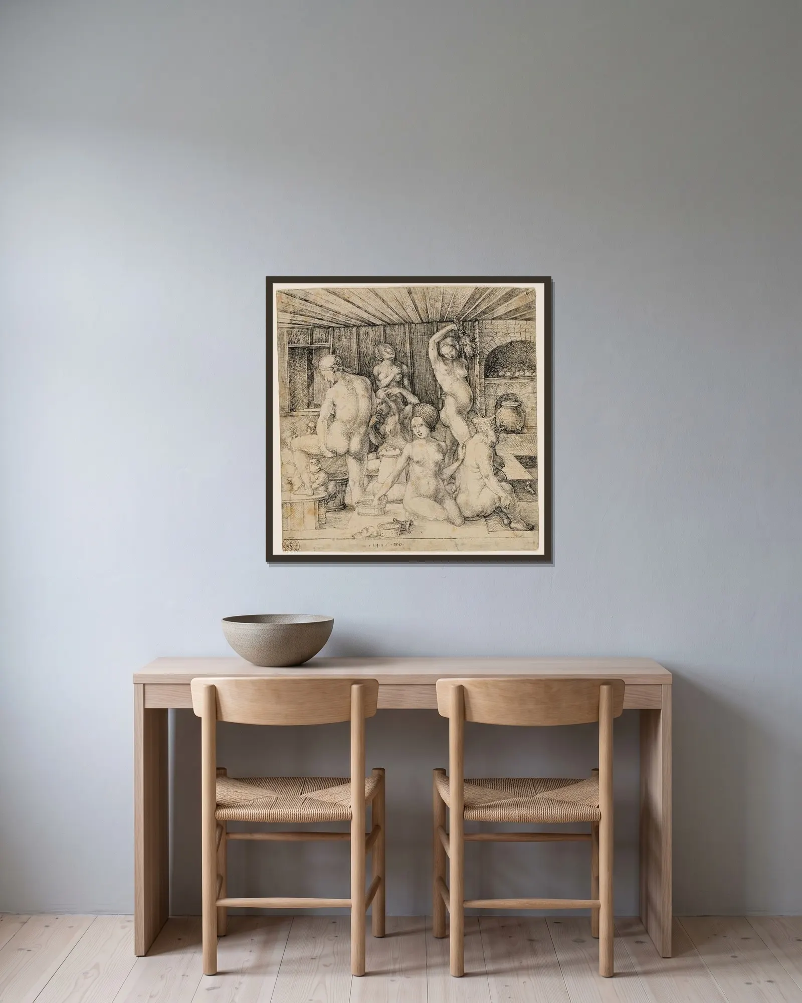 The Women’s Bath av Albrecht Dürer inramad på en vägg
