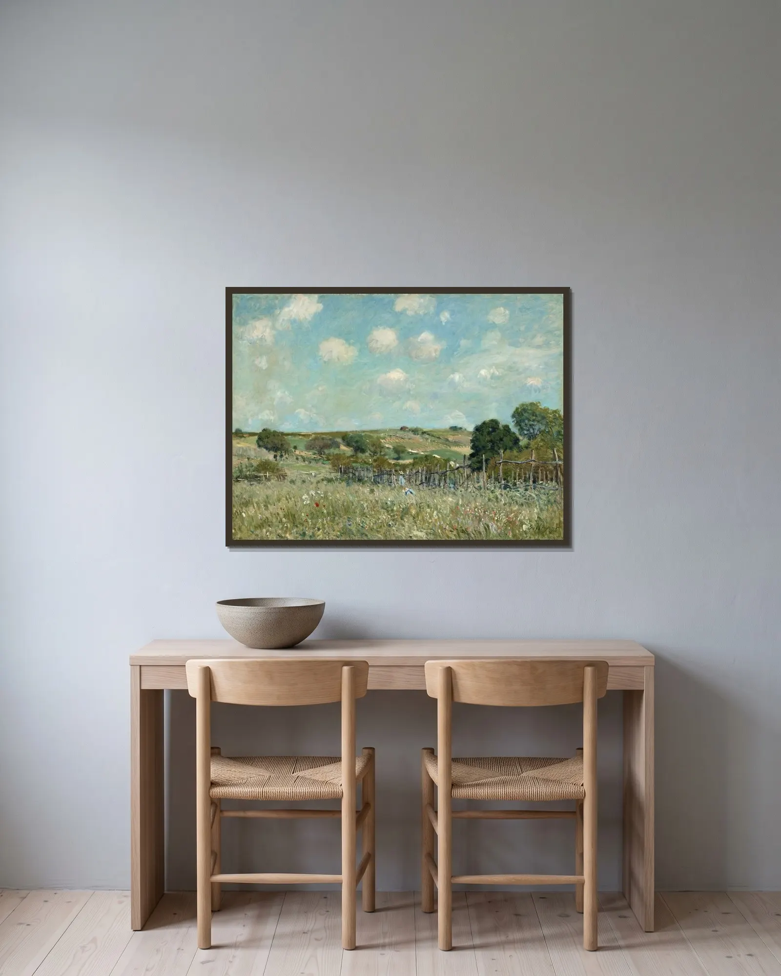 Meadow av Alfred Sisley inramad på en vägg