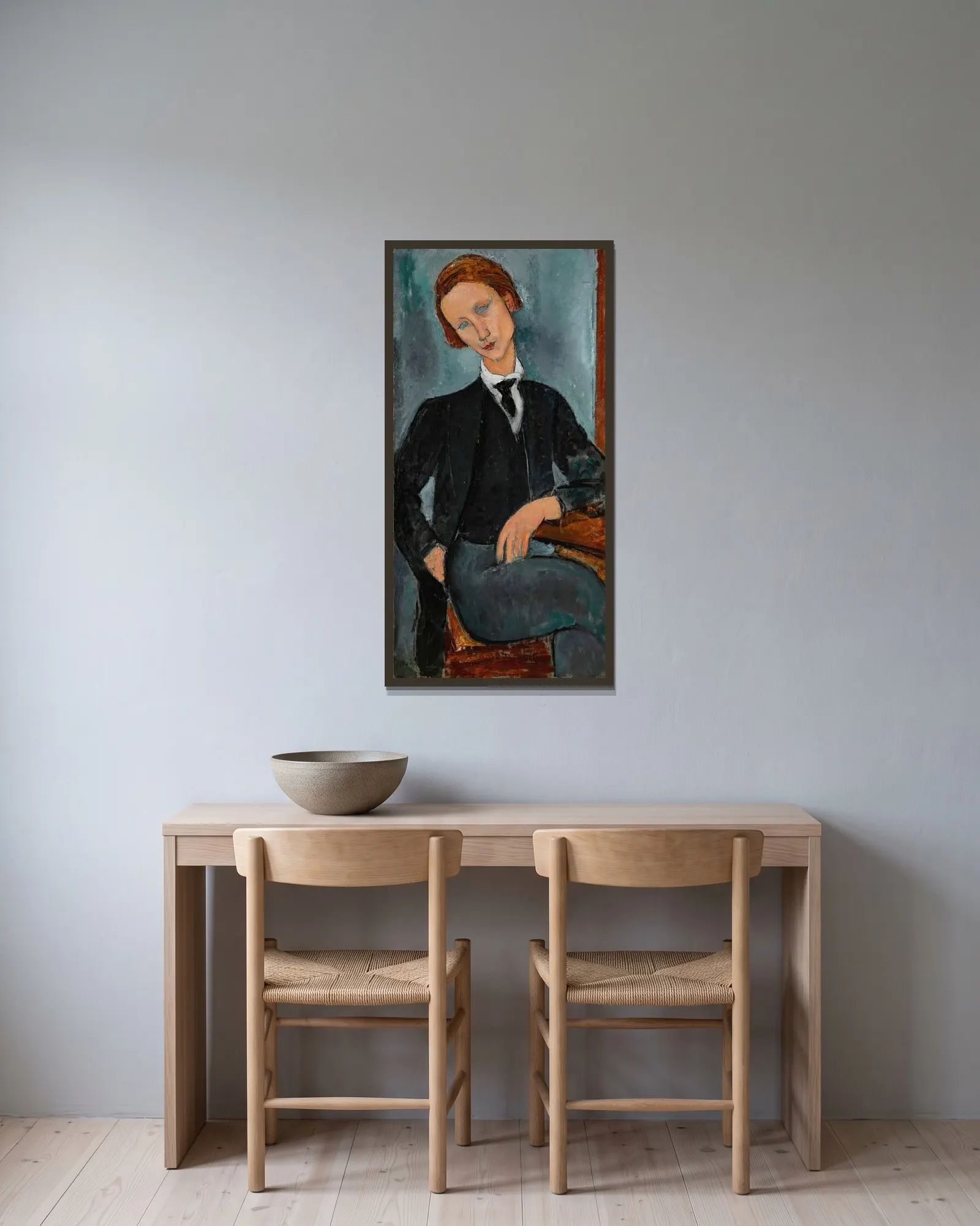 Portrait de Baranowski av Amedeo Modigliani inramad på en vägg