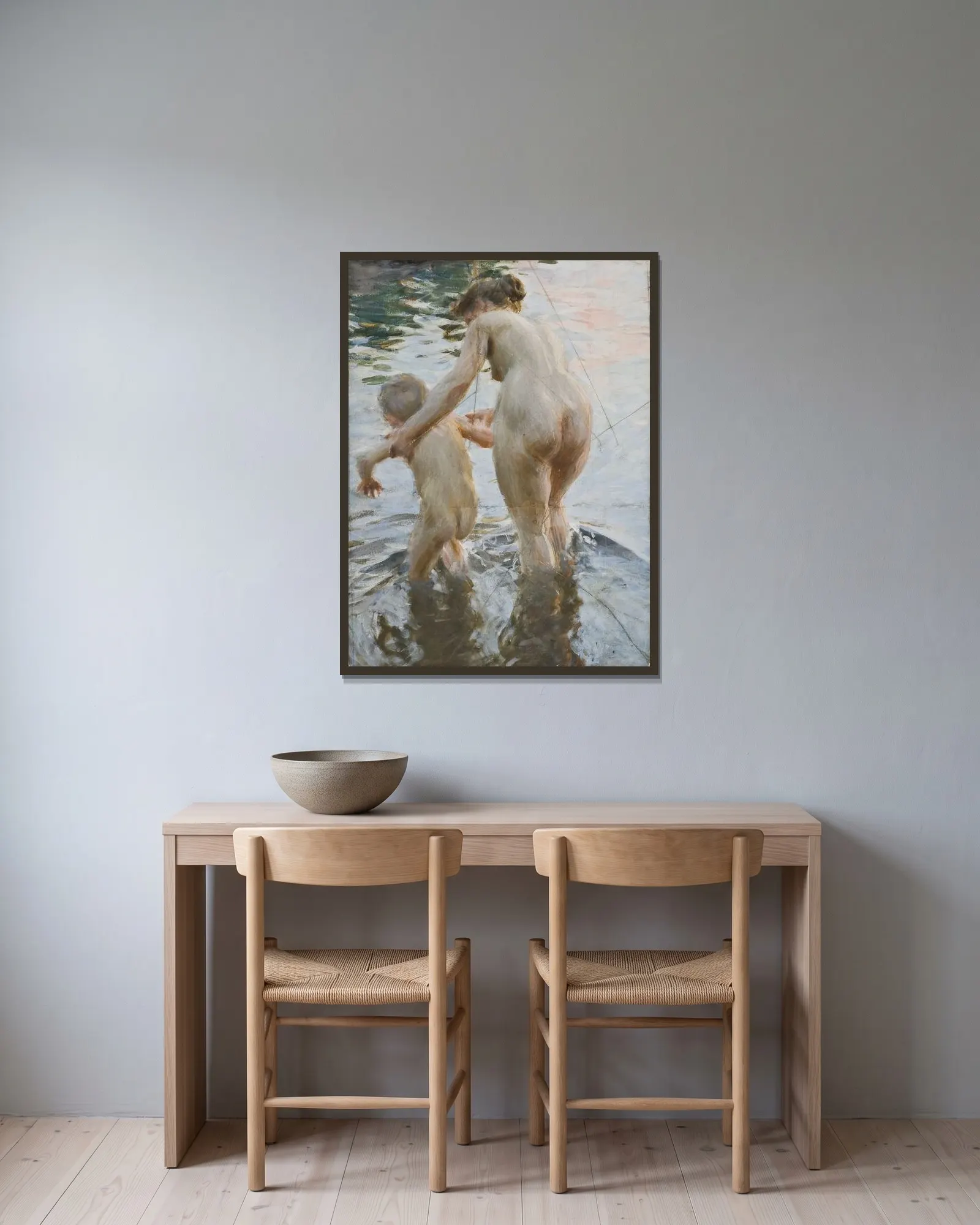 Une première av Anders Zorn inramad på en vägg