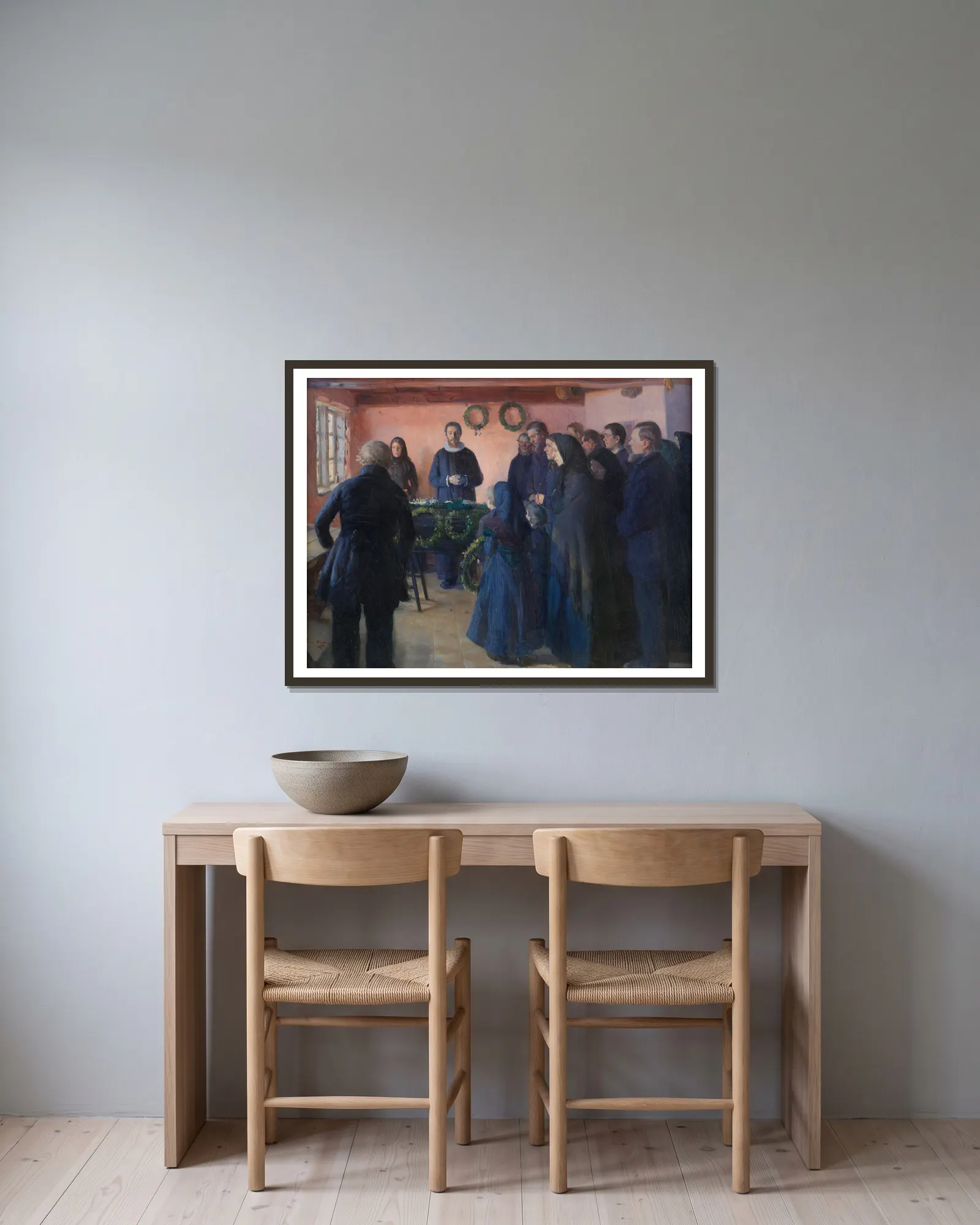 A Funeral av Anna Ancher inramad på en vägg