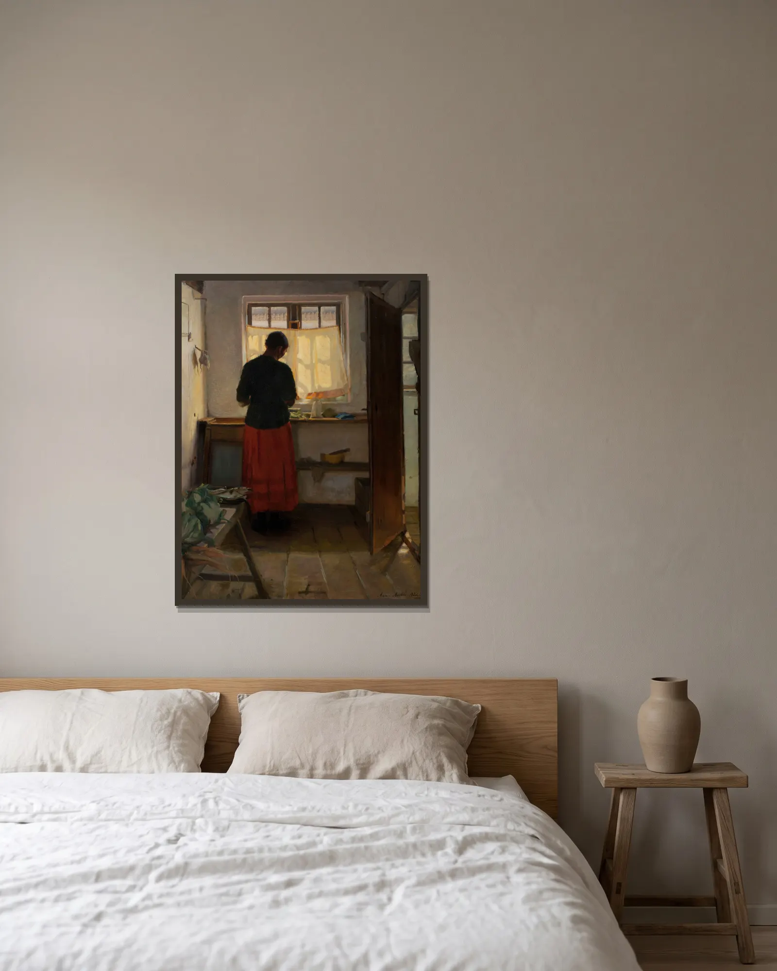 The maid in the kitchen av Anna Ancher inramad på en vägg