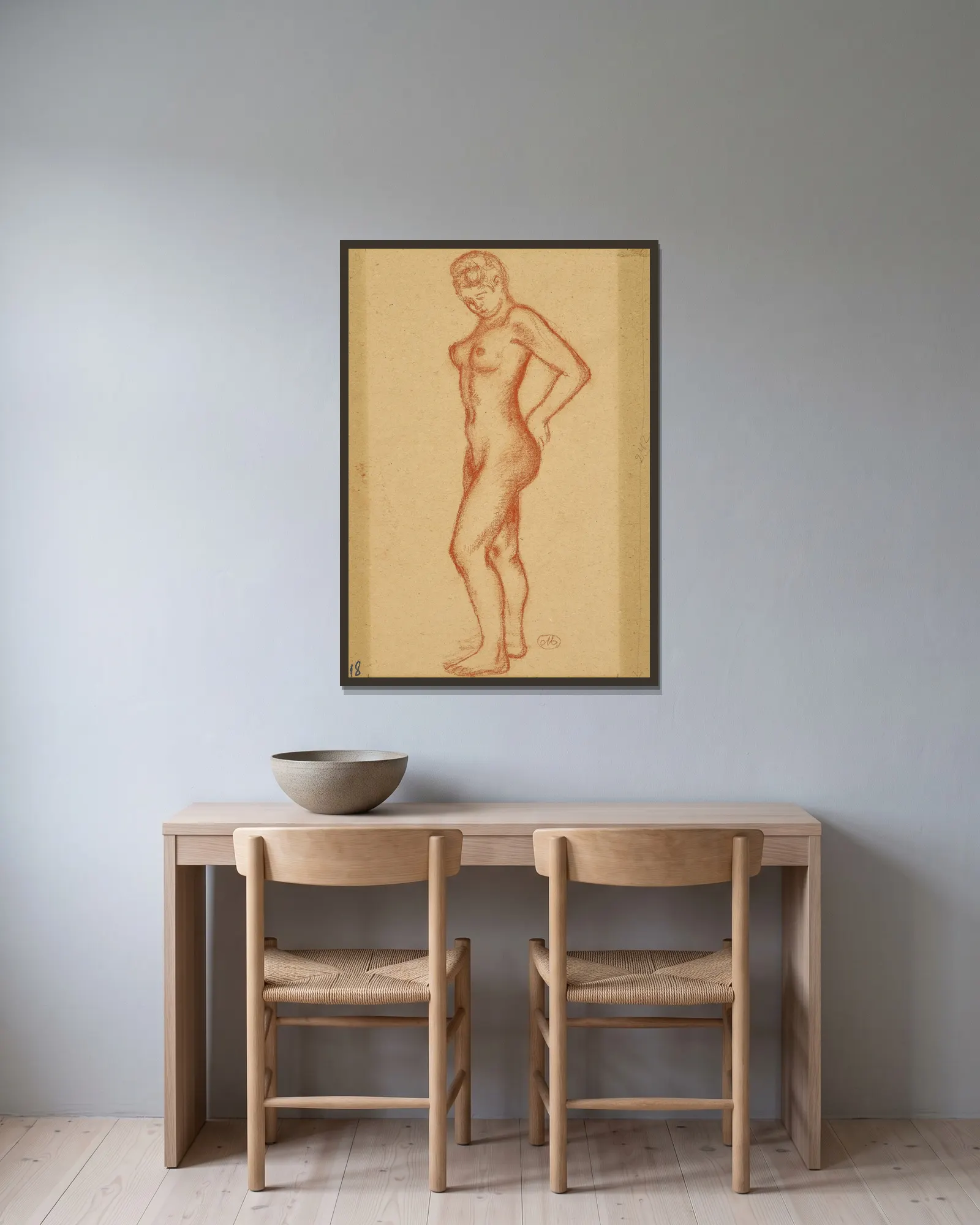 Nu debout av Aristide Maillol inramad på en vägg