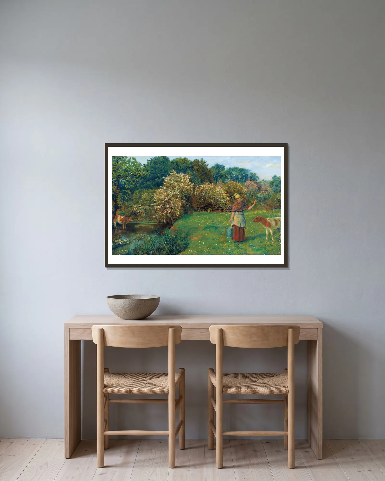Poll The Milkmaid av Arthur Hughes inramad på en vägg