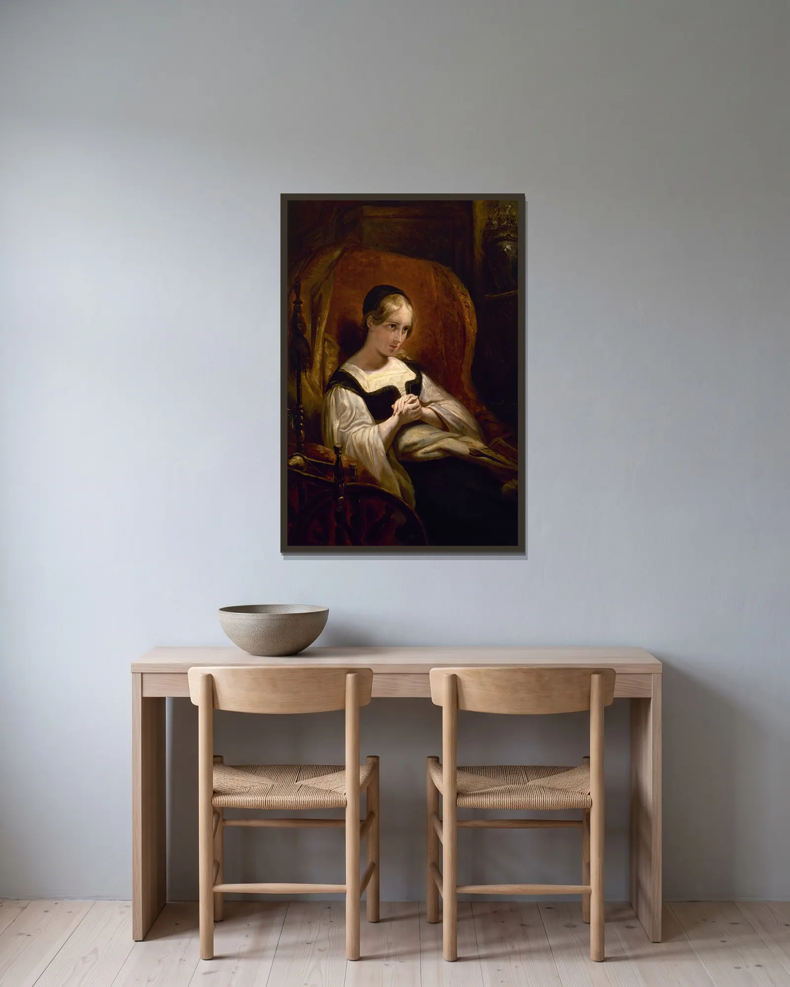 Marguerite au Rouet av Ary Scheffer inramad på en vägg