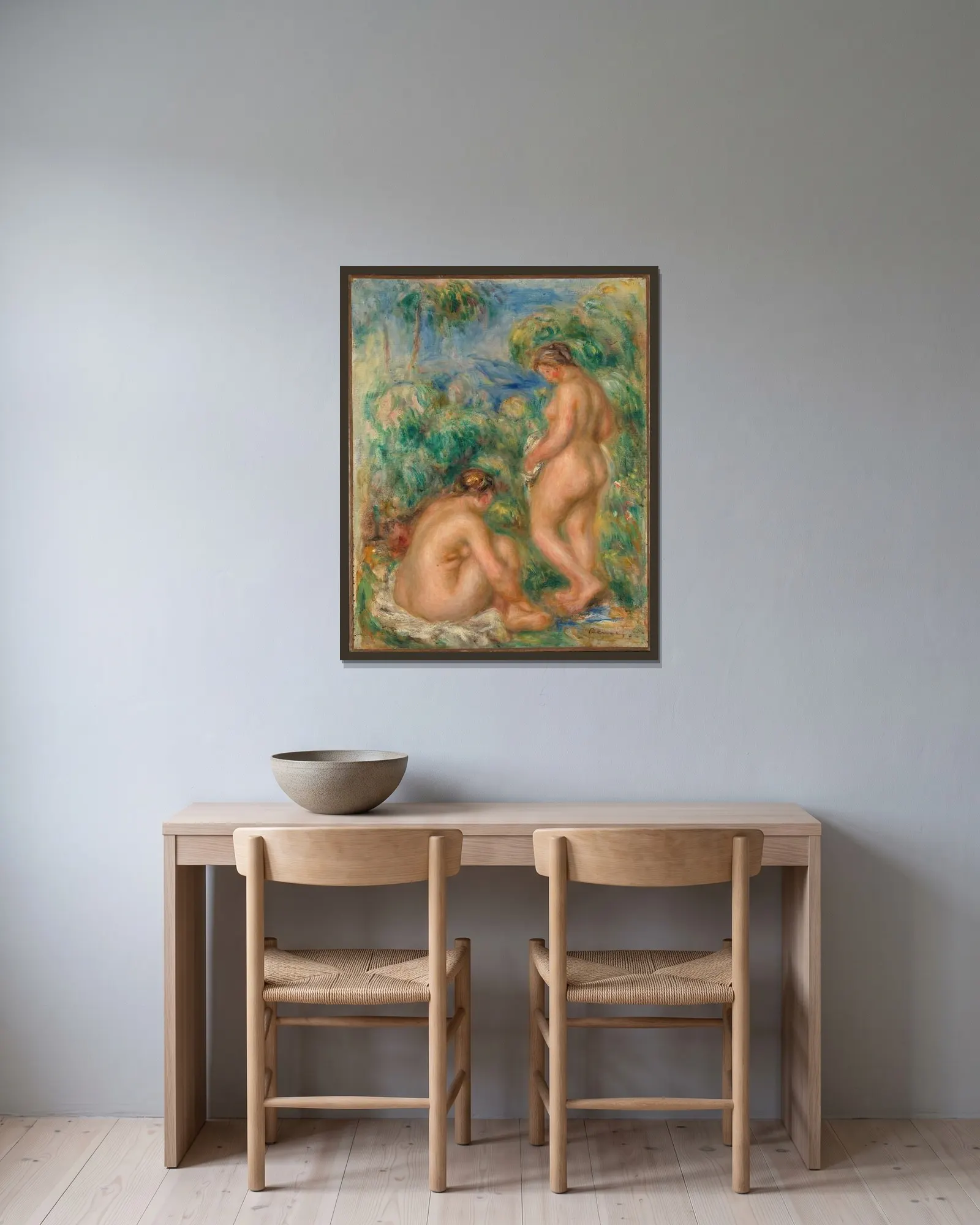 Bathing women av Pierre-Auguste Renoir inramad på en vägg