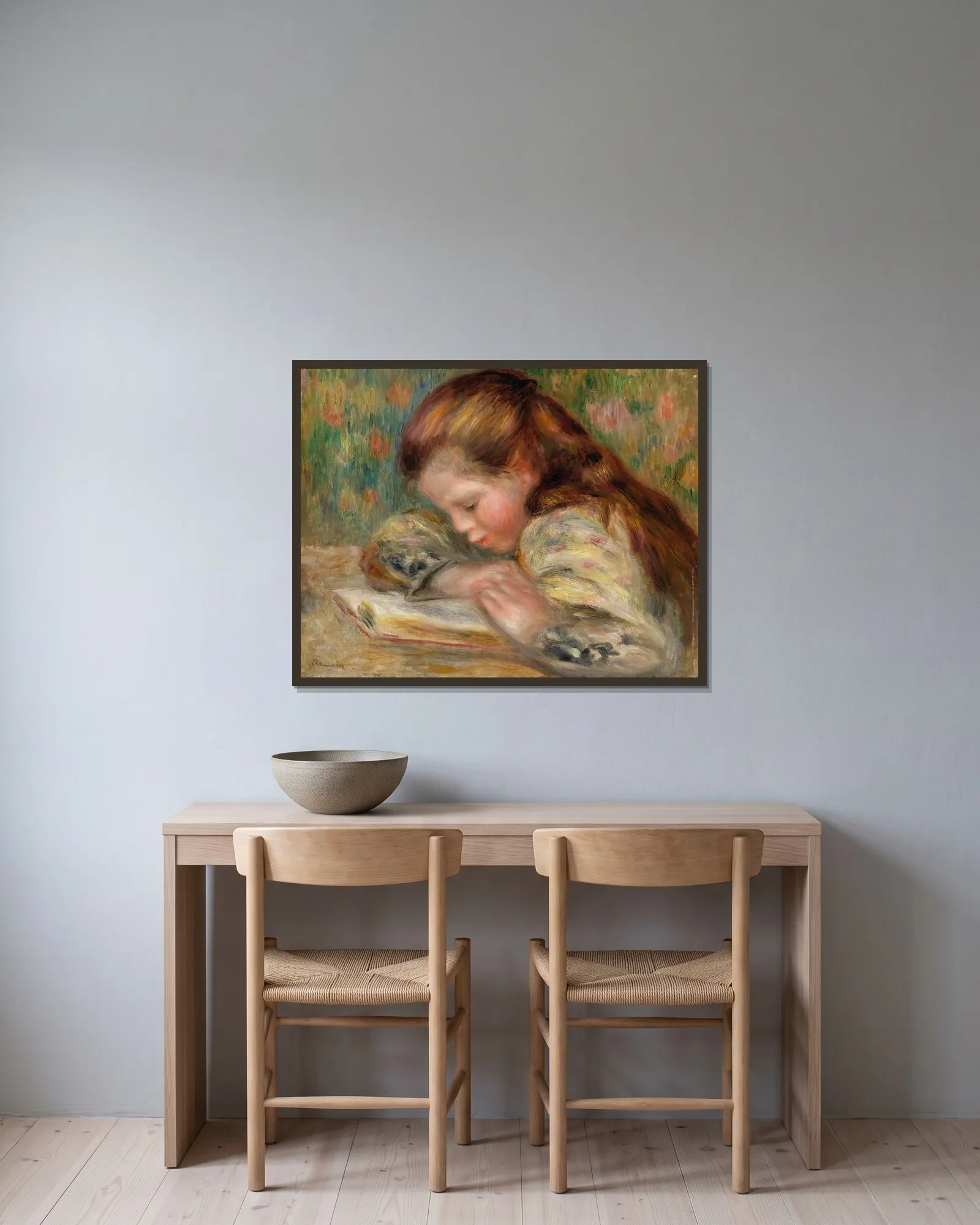 Child Reading (Enfant lisant) av Pierre-Auguste Renoir inramad på en vägg