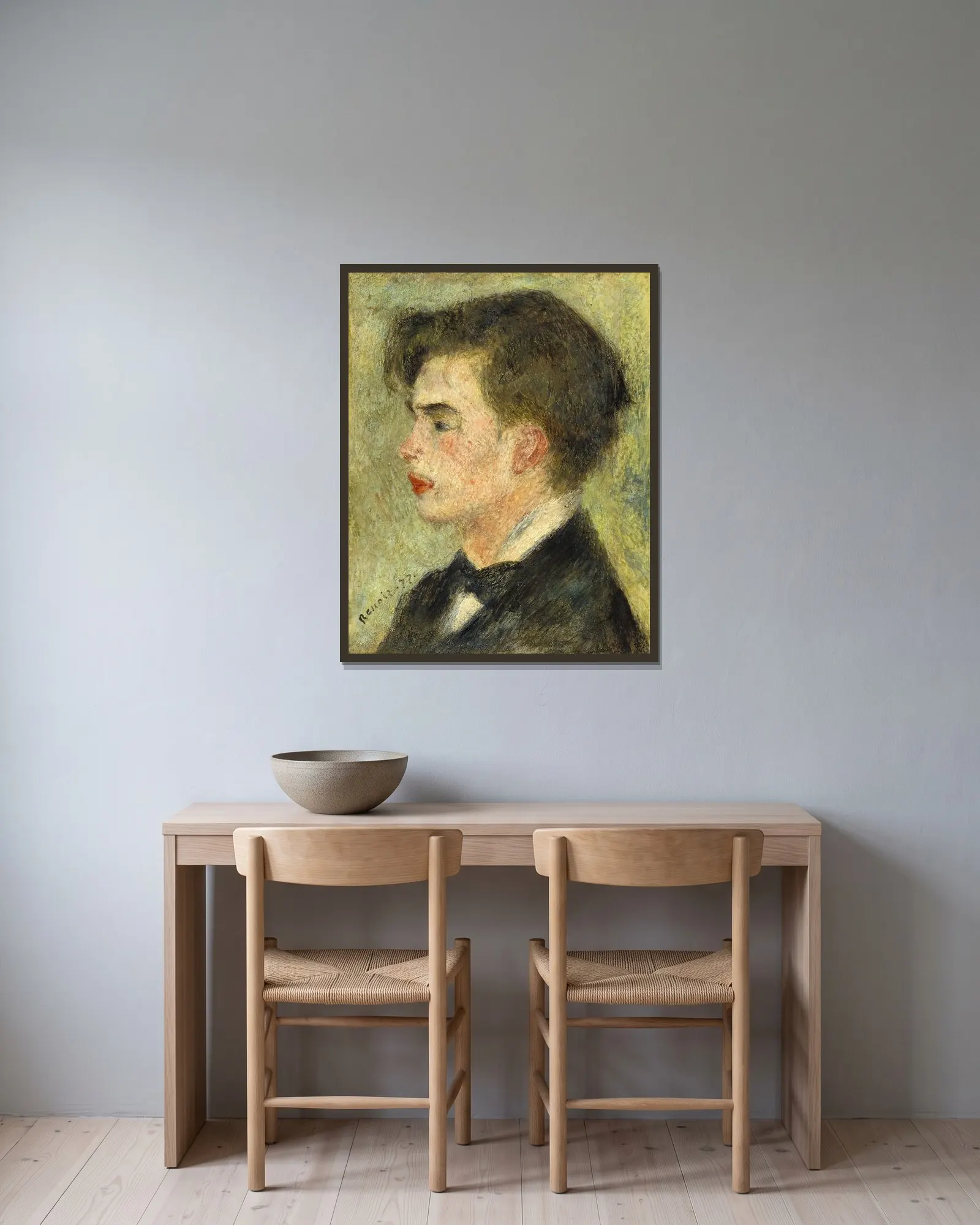 Georges Rivière av Pierre-Auguste Renoir inramad på en vägg