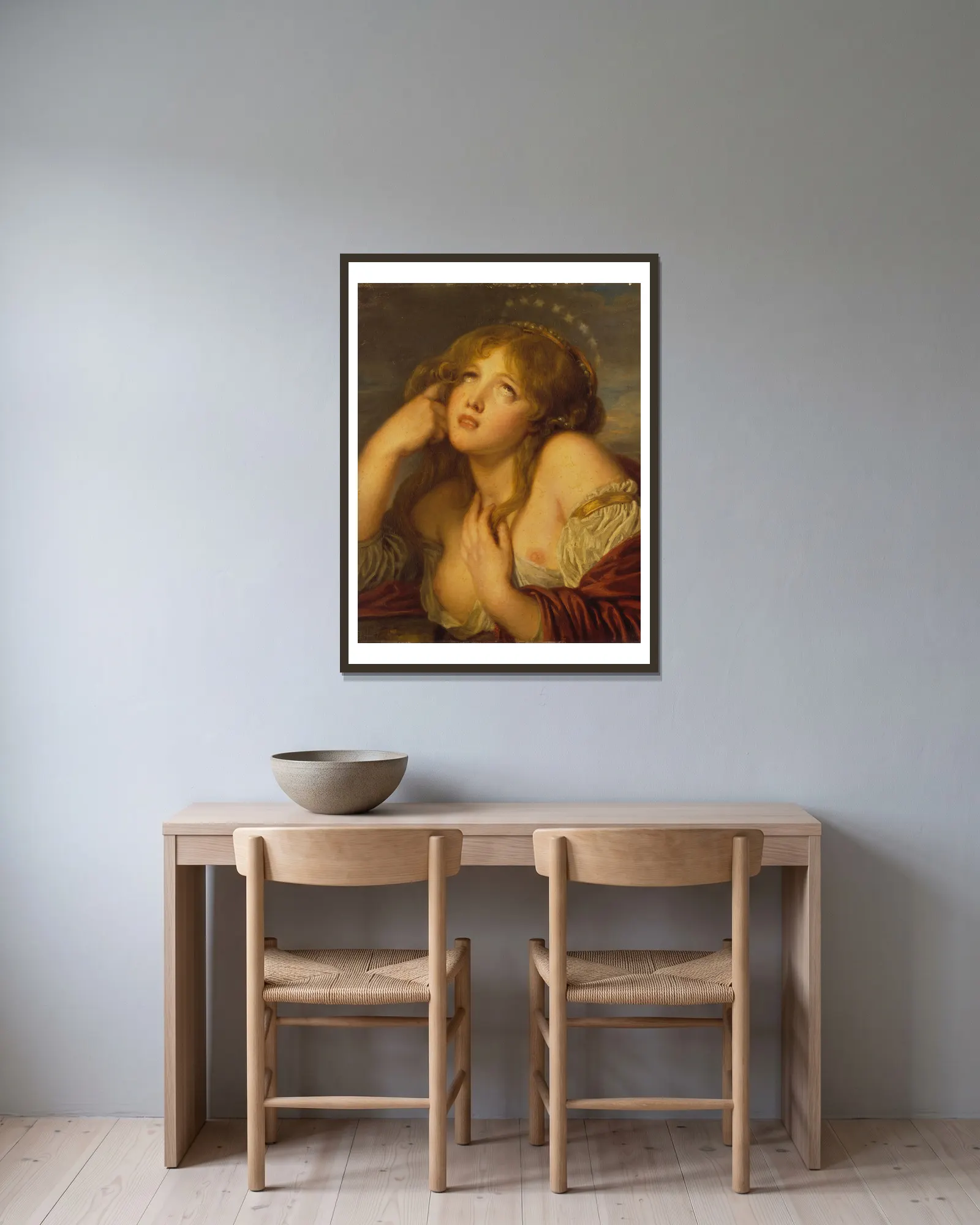 Ariadne av Jean-Baptiste Greuze inramad på en vägg