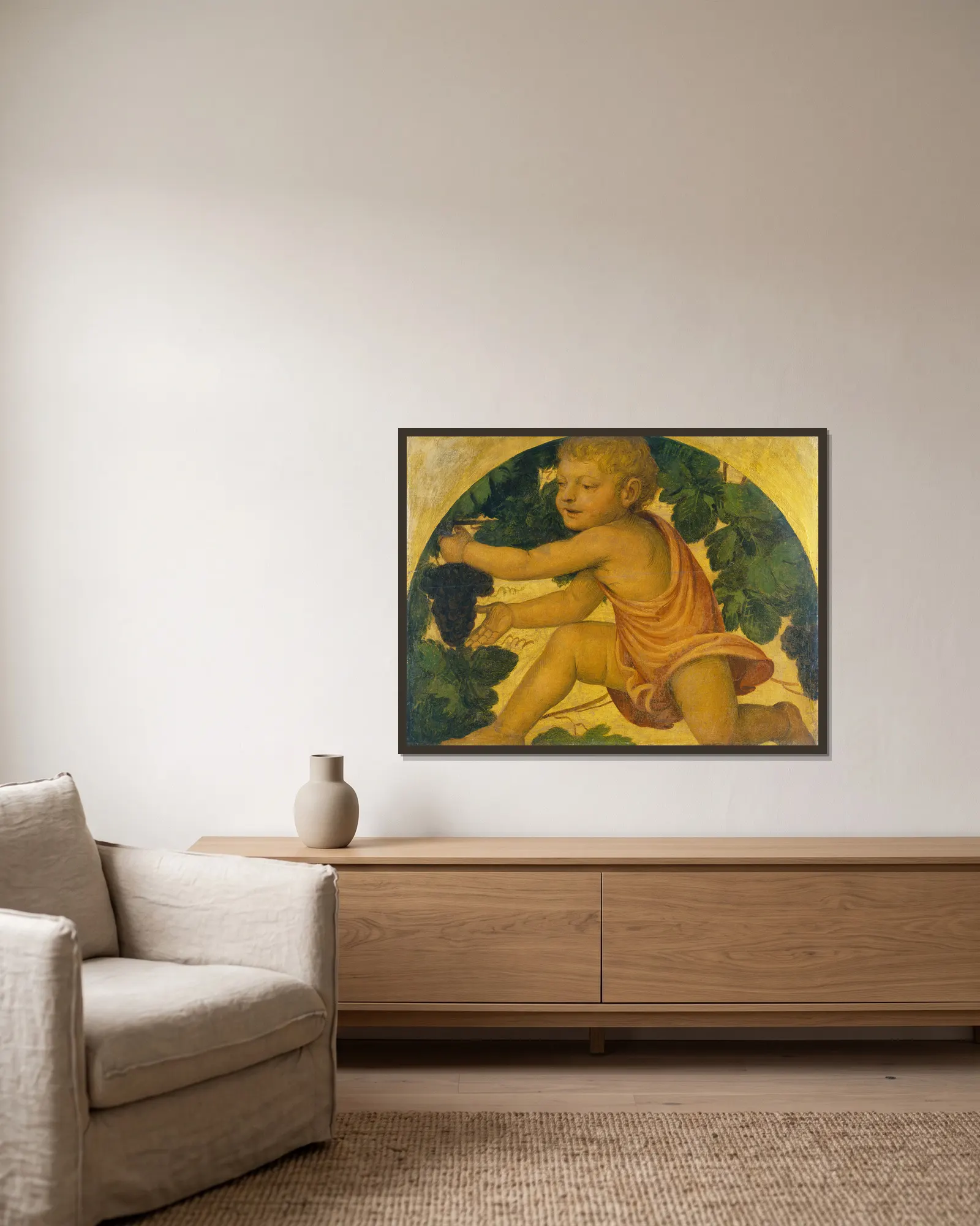 Putto picking Grapes av Bernardino Luini inramad på en vägg