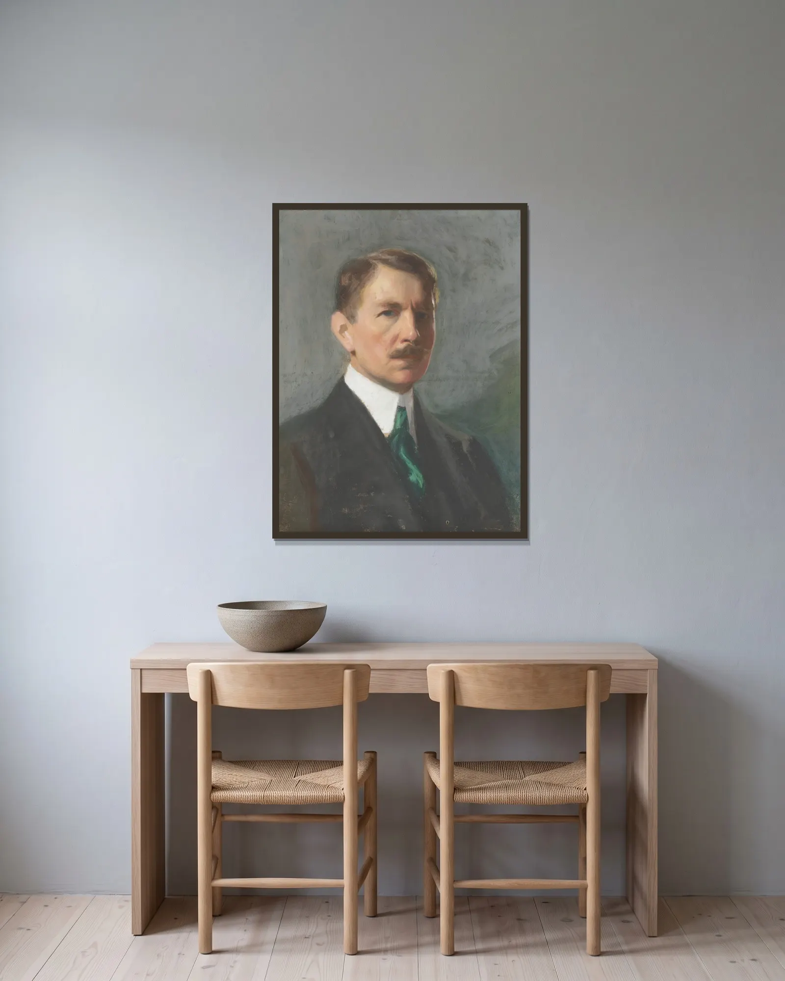 Self-portrait av Bernhard Österman inramad på en vägg