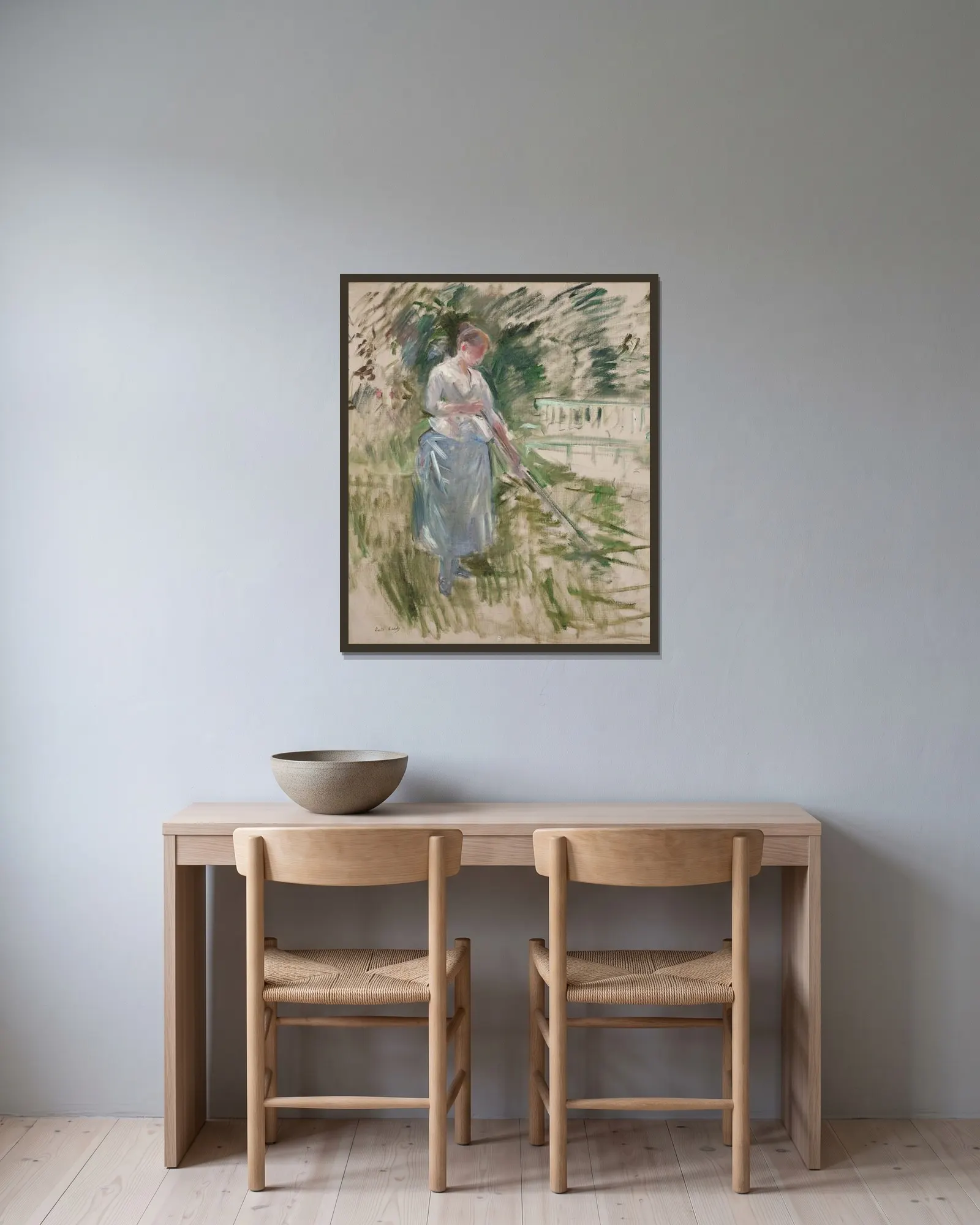 Faneuse av Berthe Morisot inramad på en vägg
