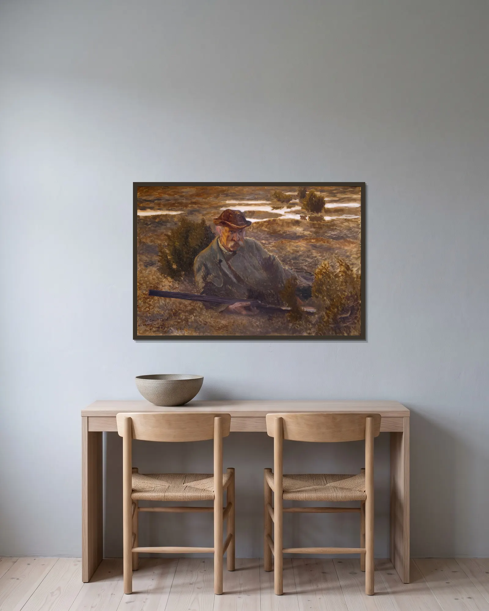 Self-portrait av Bruno Liljefors inramad på en vägg