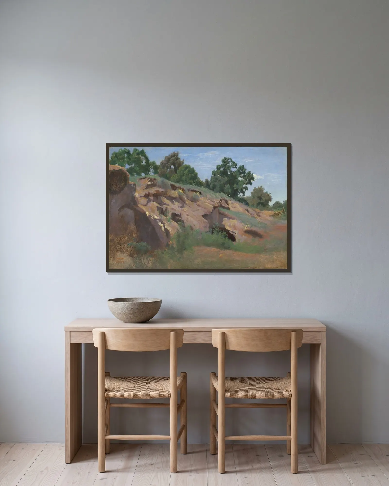 Versant rocheux av Jean-Baptiste-Camille Corot inramad på en vägg