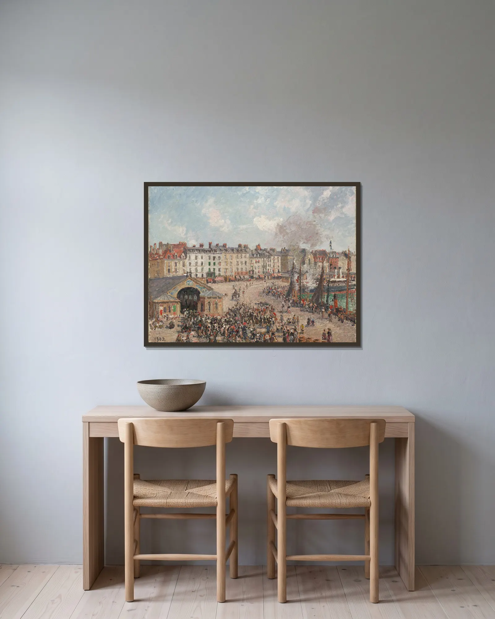 Fishmarket av Camille Pissarro inramad på en vägg