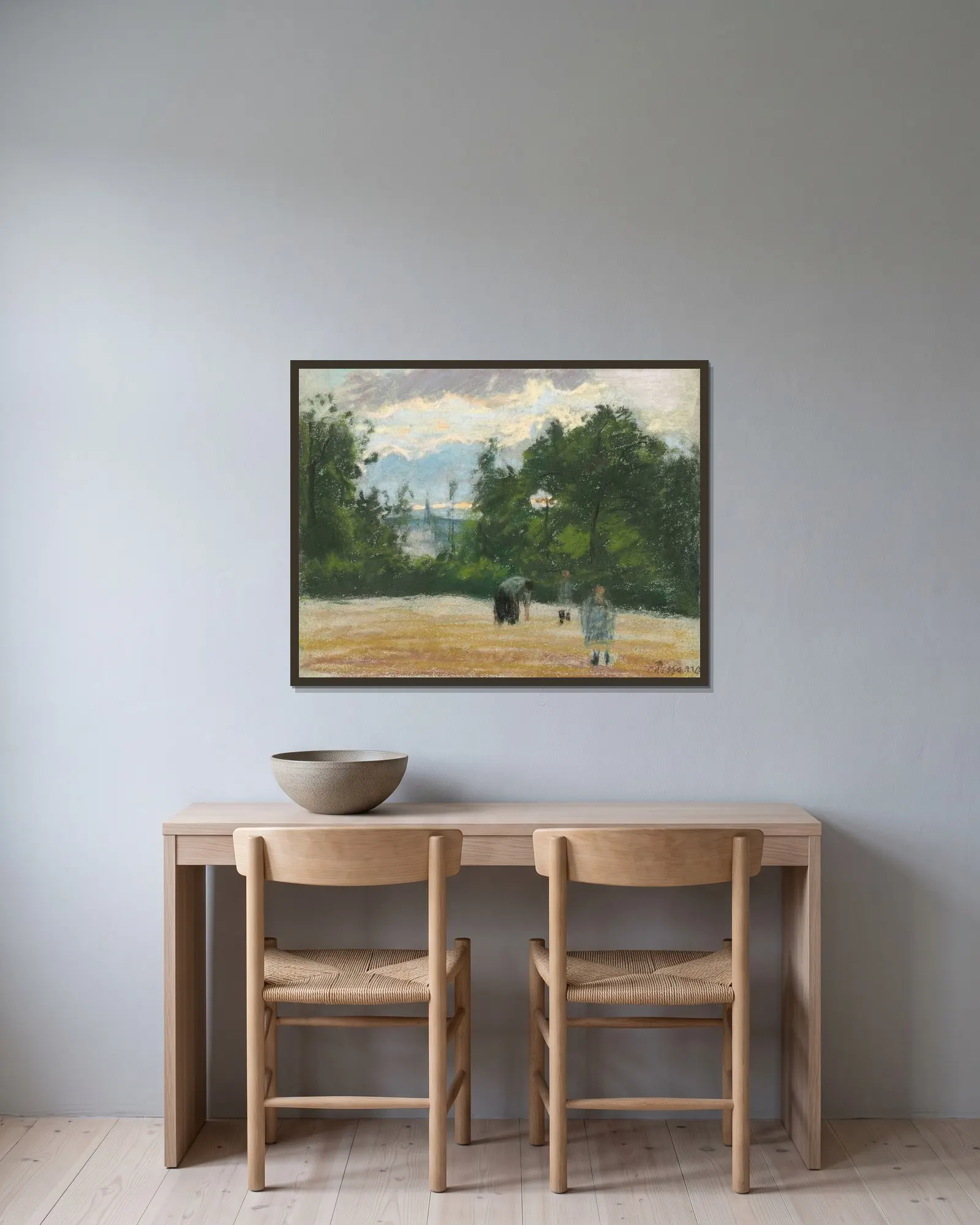 La clairière av Camille Pissarro inramad på en vägg