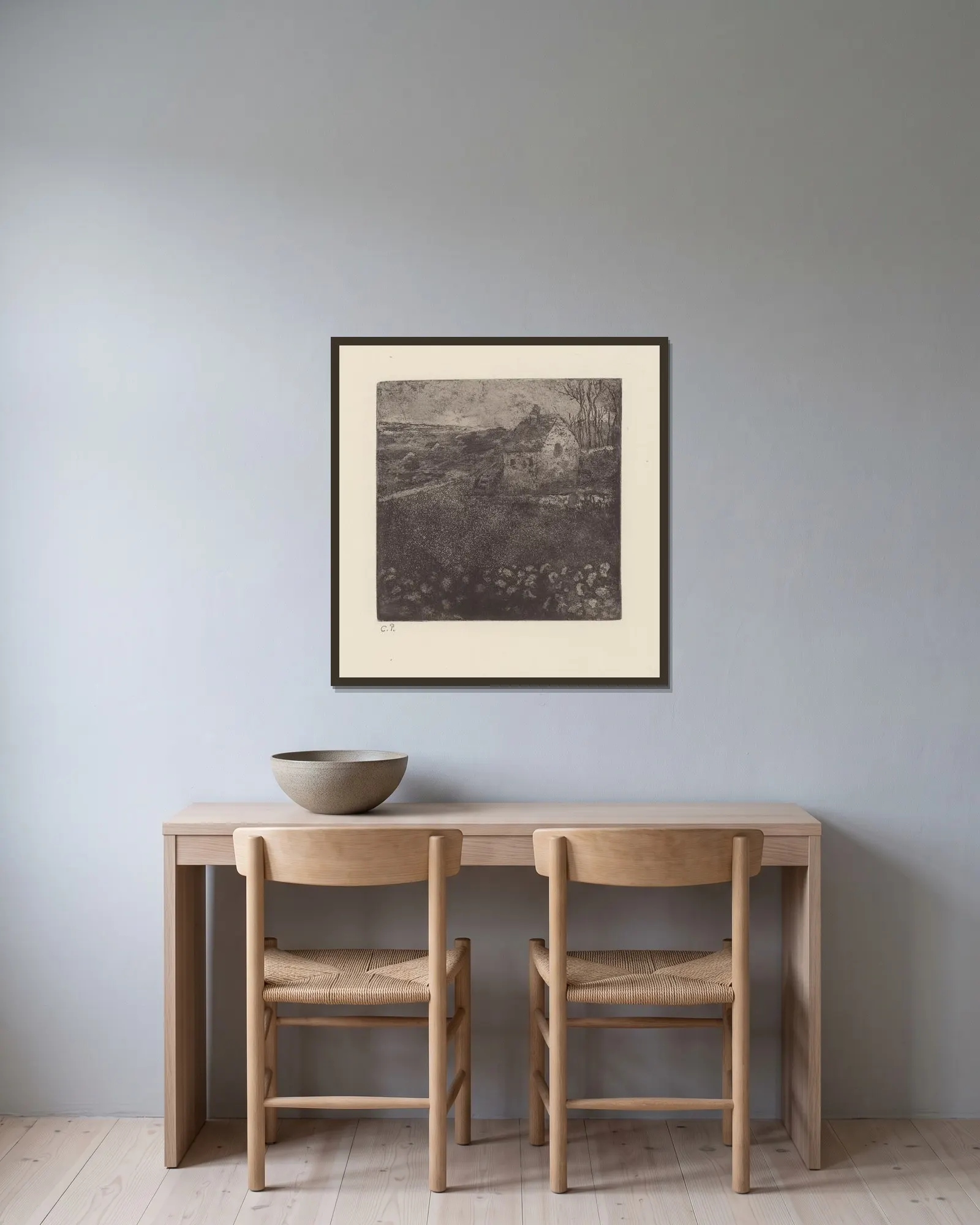 La masure av Camille Pissarro inramad på en vägg