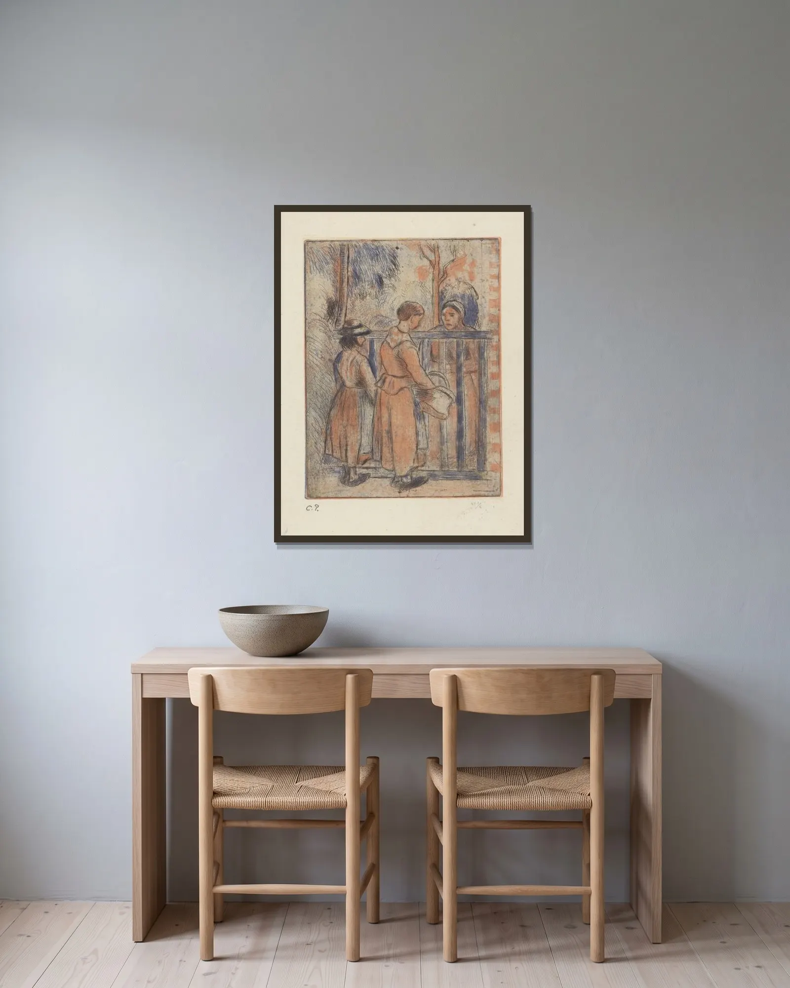 Mendiantes av Camille Pissarro inramad på en vägg