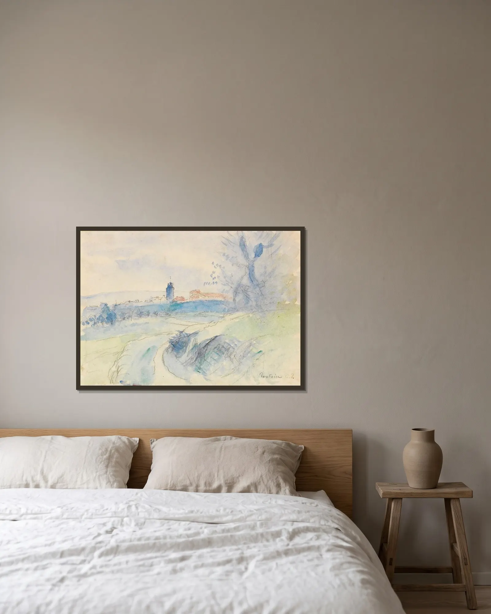 Pontoise av Camille Pissarro inramad på en vägg