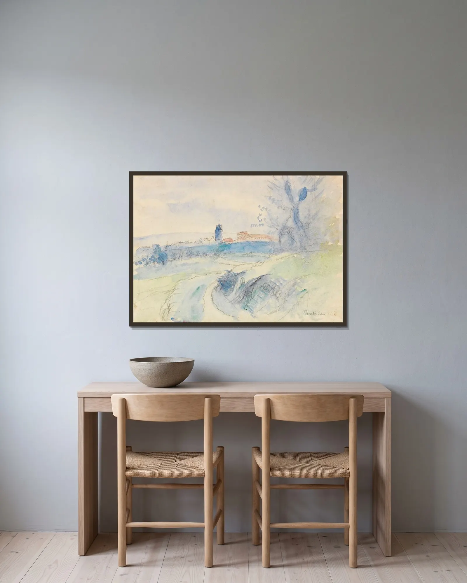 Pontoise av Camille Pissarro inramad på en vägg