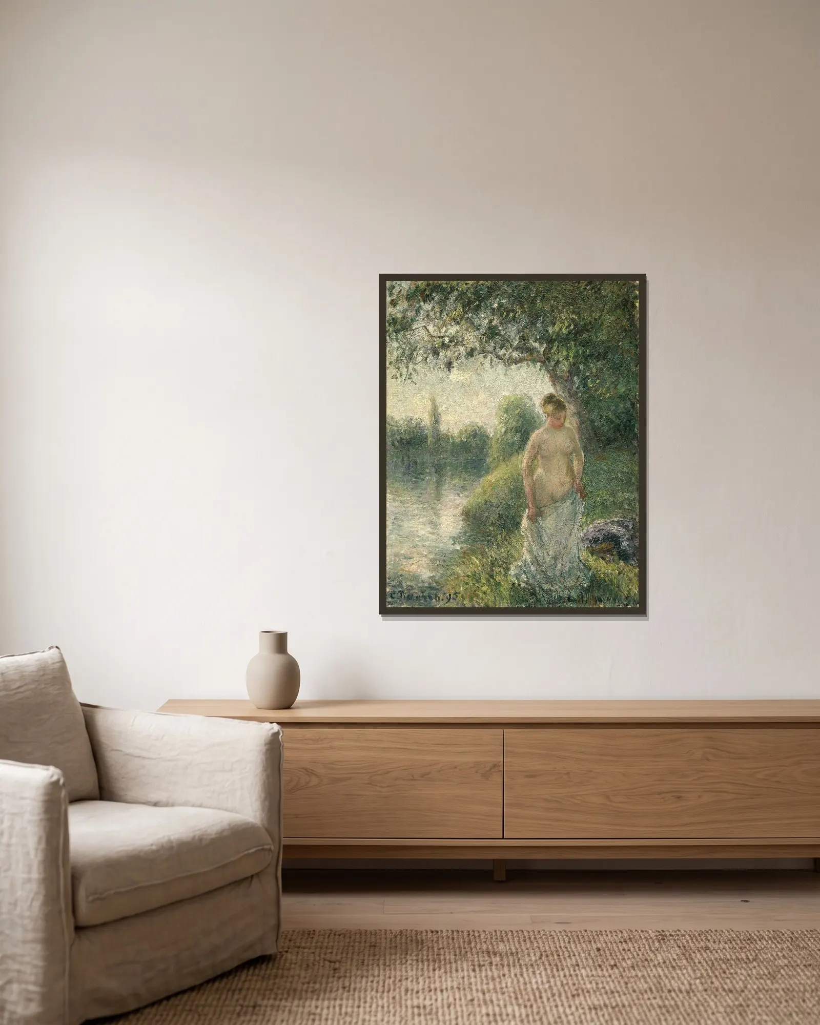 The Bather av Camille Pissarro inramad på en vägg