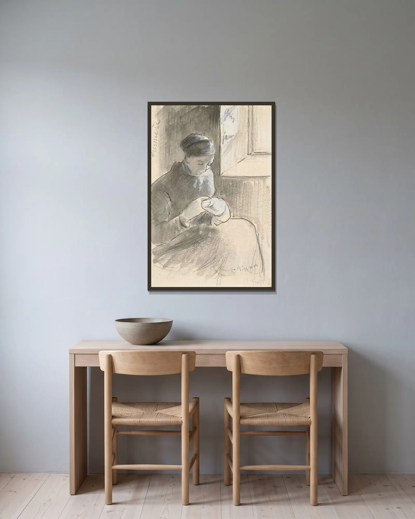 The Mender av Camille Pissarro inramad på en vägg
