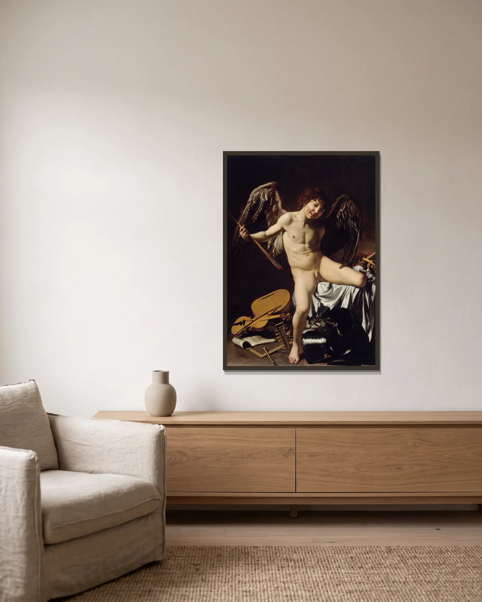 Amor Vincit Omnia av Caravaggio inramad på en vägg