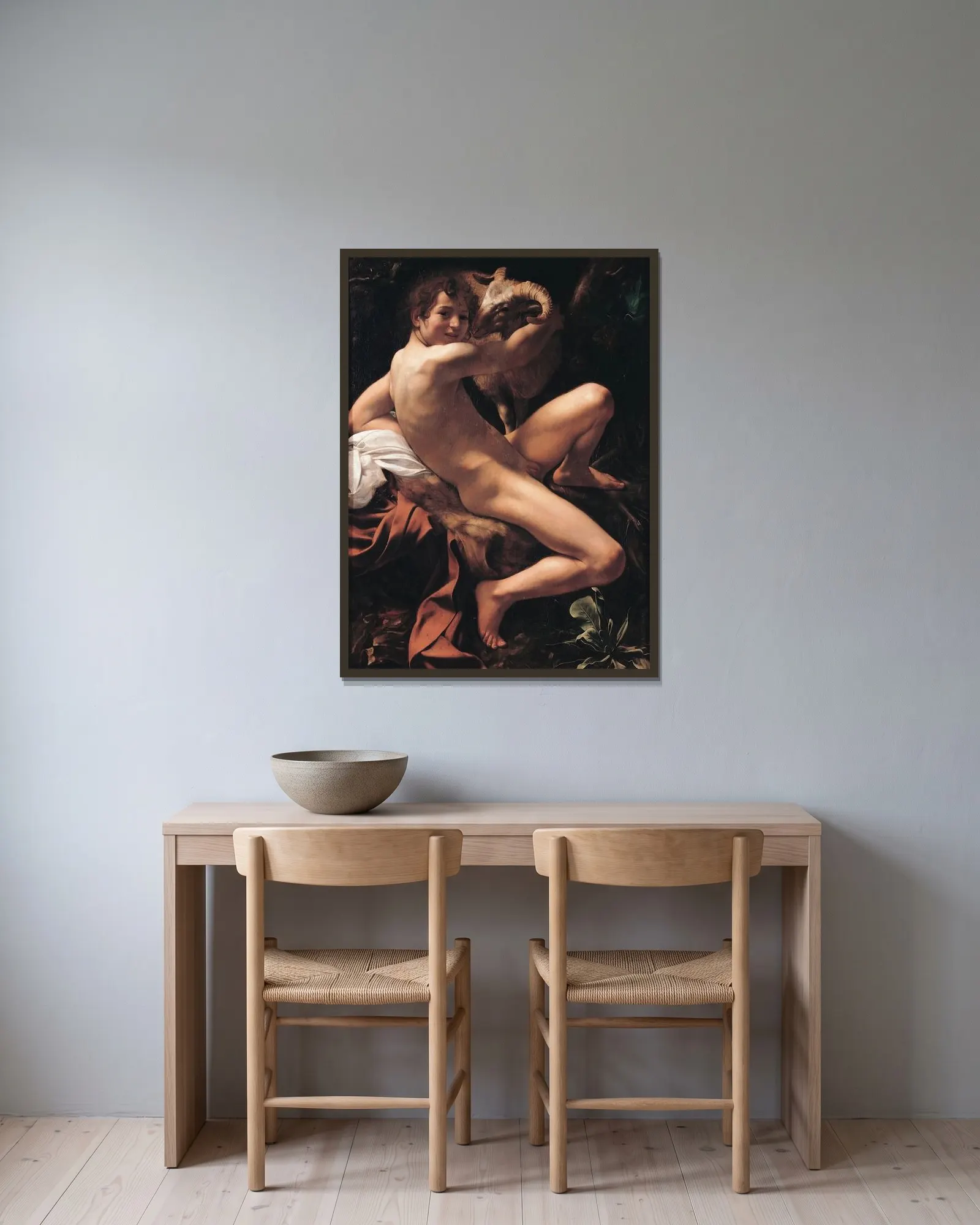 Saint John the Baptist, 1602 av Caravaggio inramad på en vägg