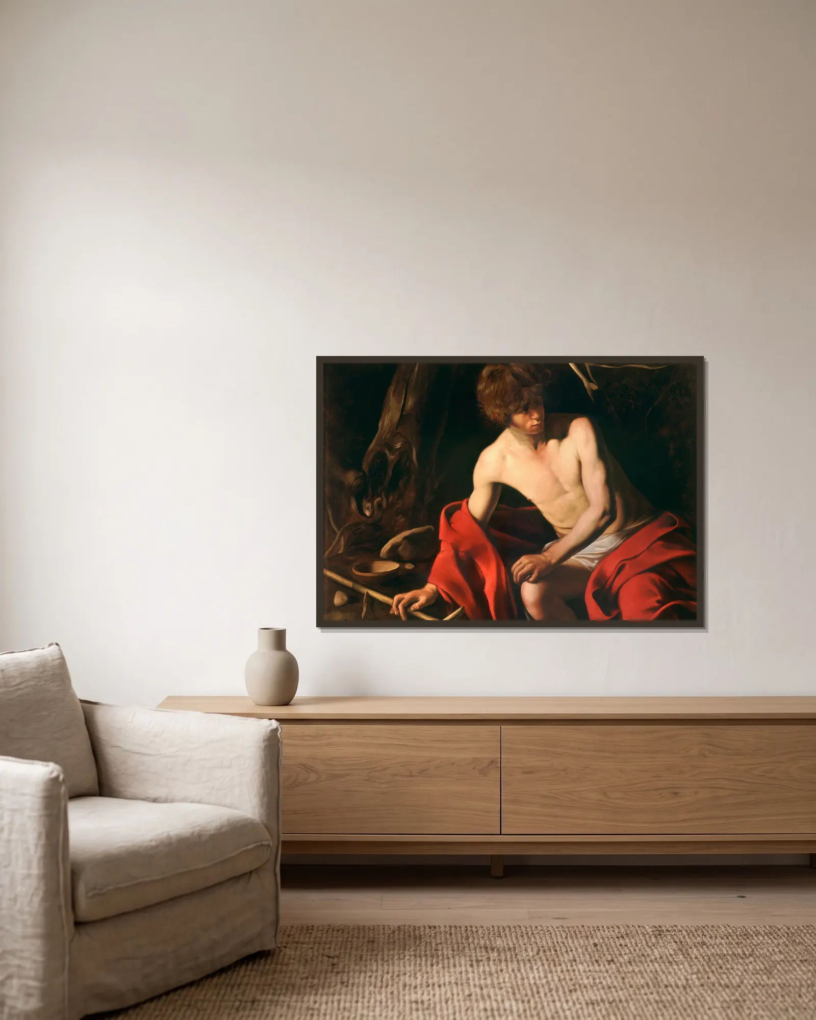 Saint John the Baptist av Caravaggio inramad på en vägg