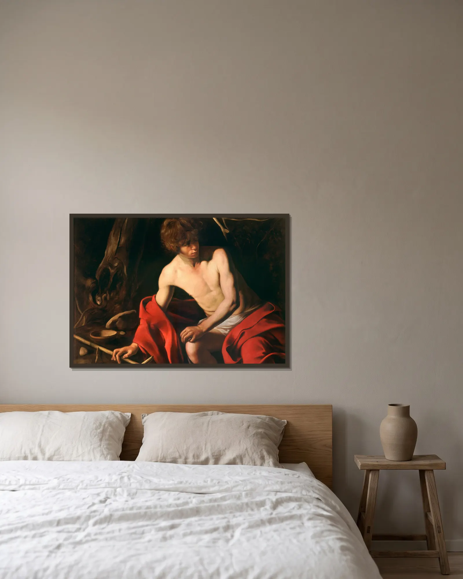 Saint John the Baptist av Caravaggio inramad på en vägg