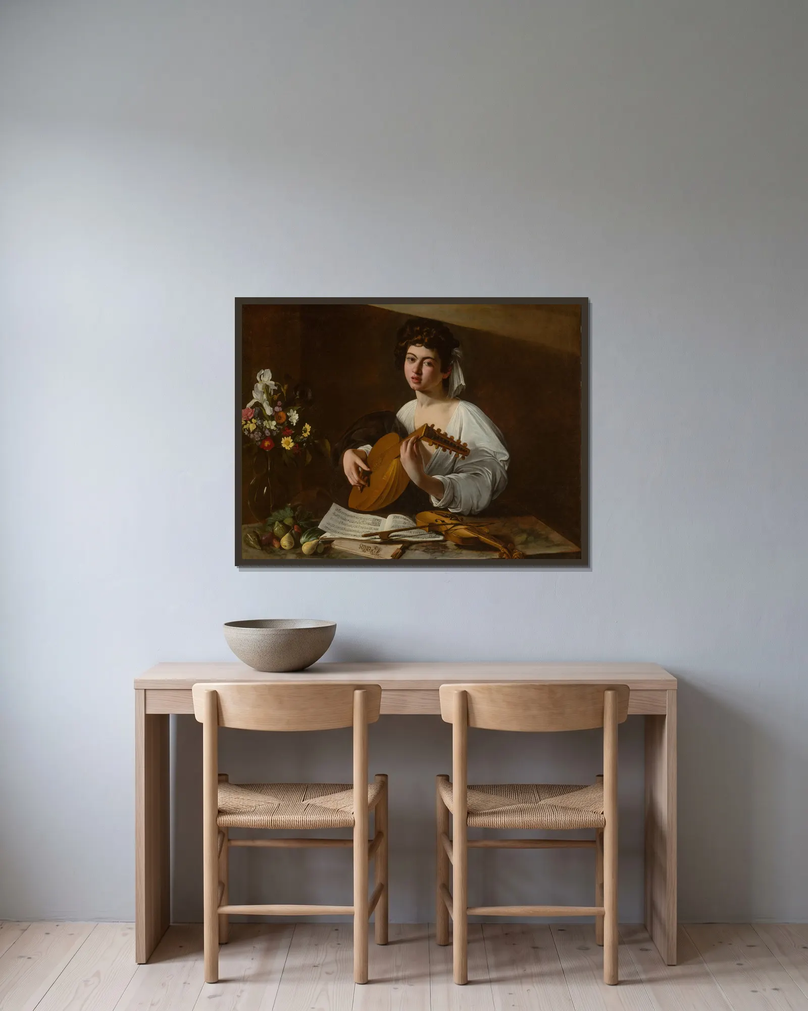 The Lute Player av Caravaggio inramad på en vägg