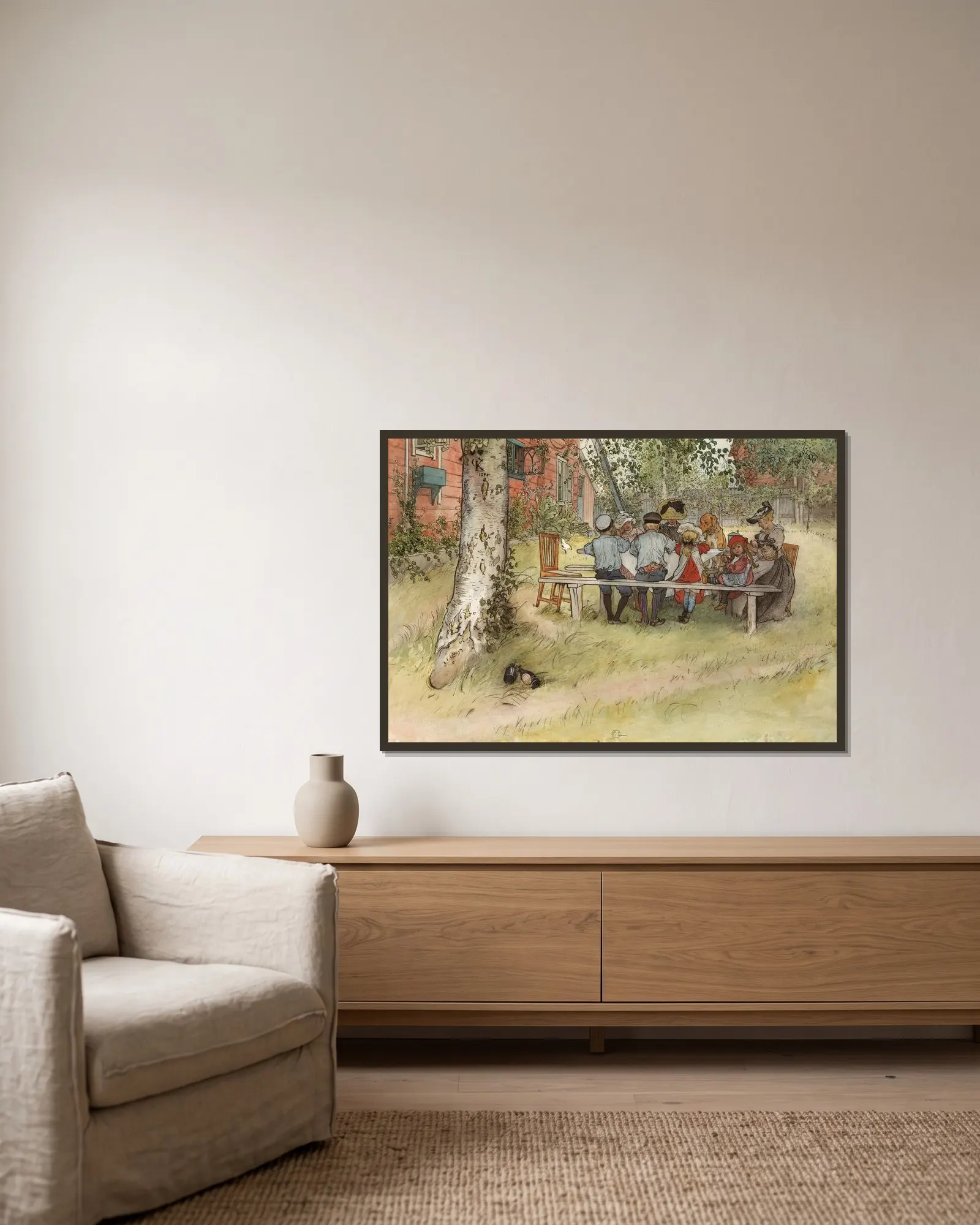 Frukost under stora björken av Carl Larsson inramad på en vägg