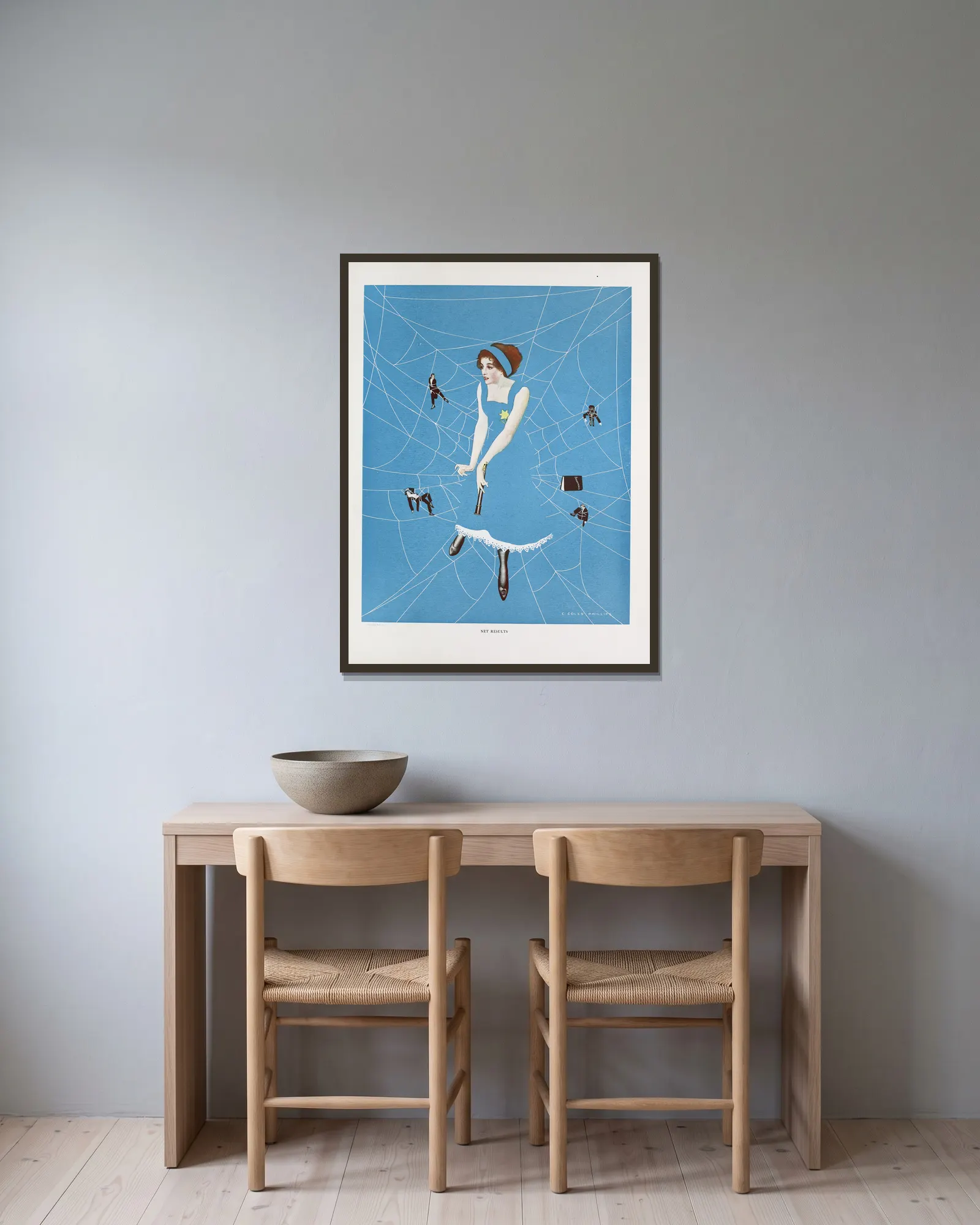 Net results av Coles Phillips inramad på en vägg