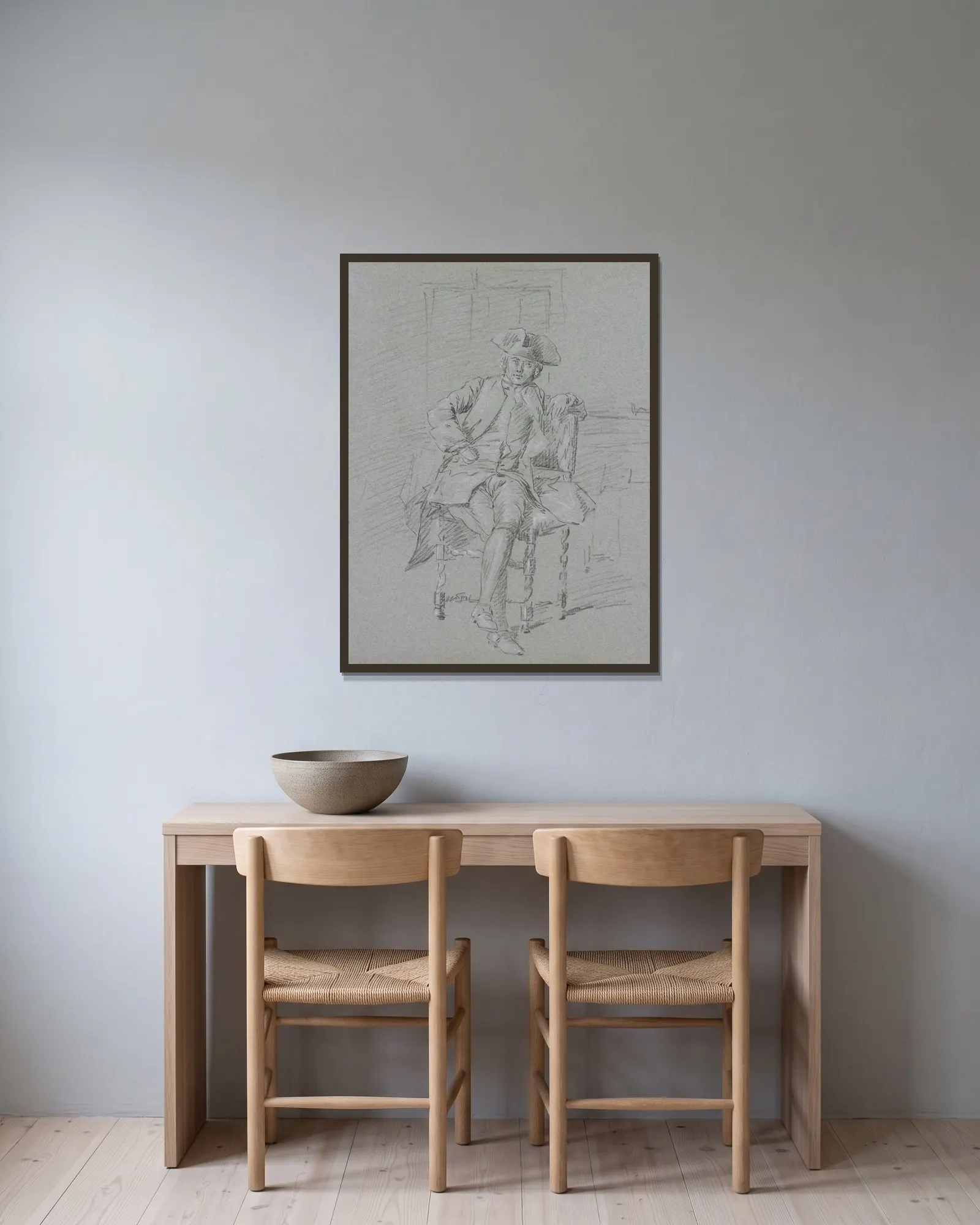 A sitting cavalier av Cornelis Troost inramad på en vägg