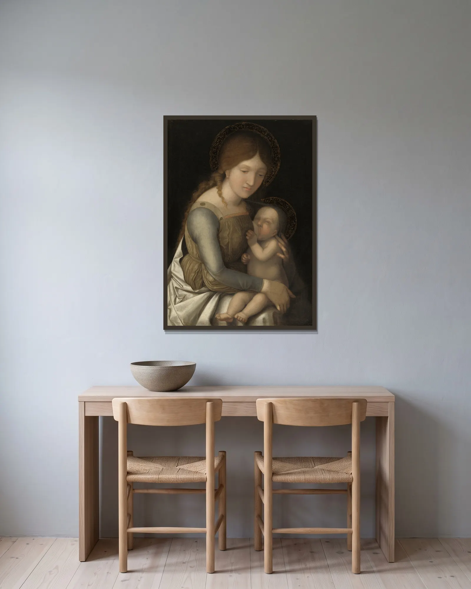 Madonna and Child av Correggio inramad på en vägg