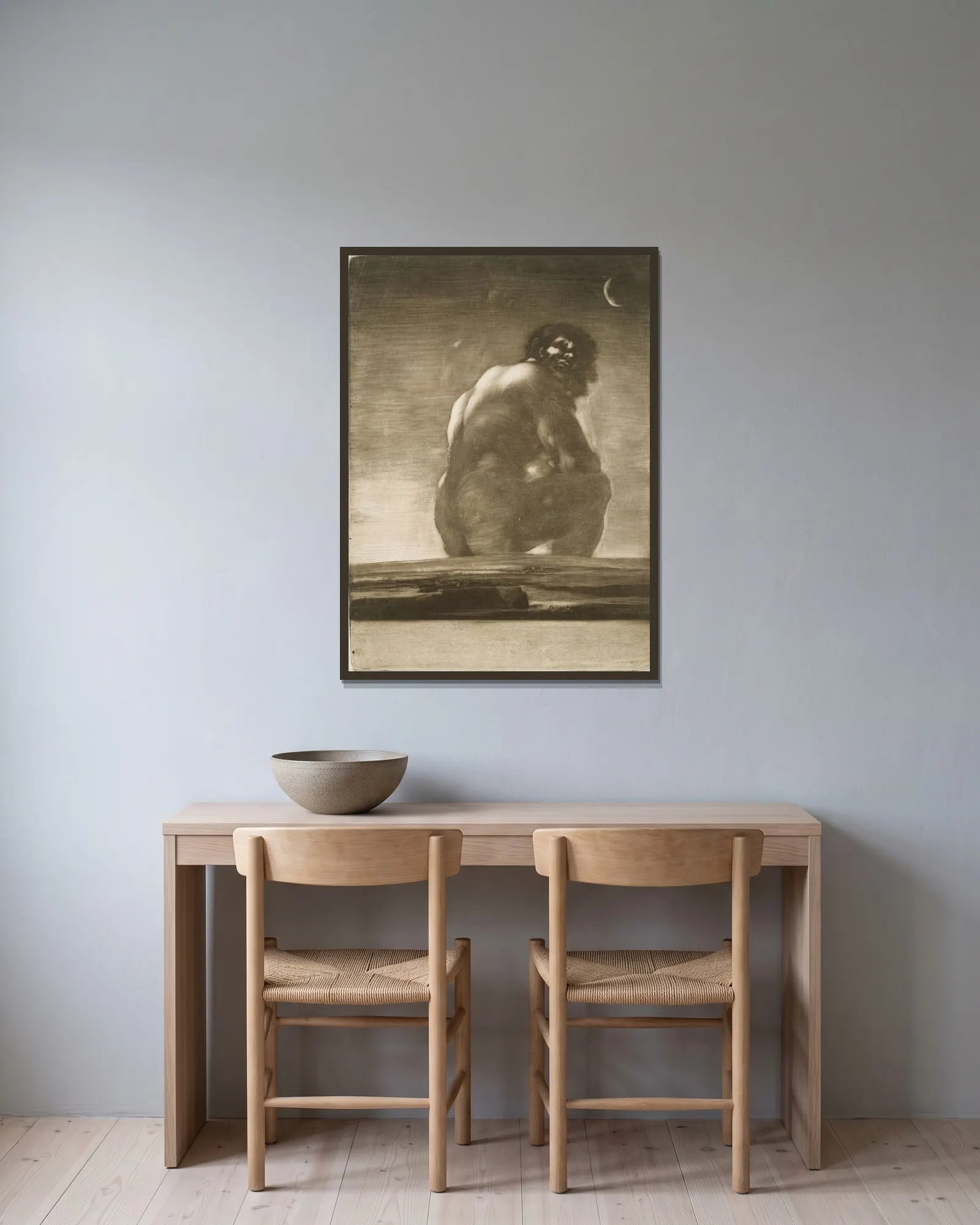 Seated Giant av Francisco de Goya inramad på en vägg