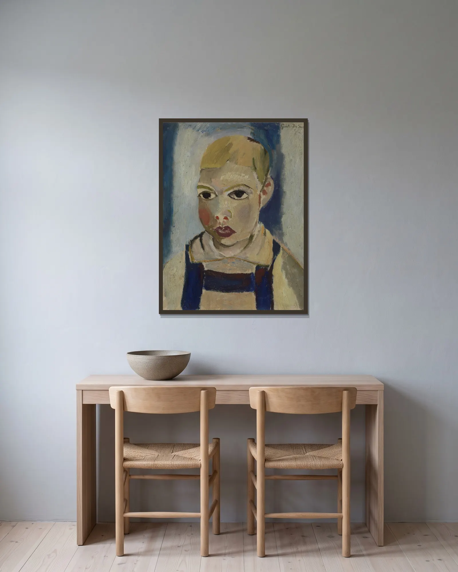 Child’s head av Gustave De Smet inramad på en vägg