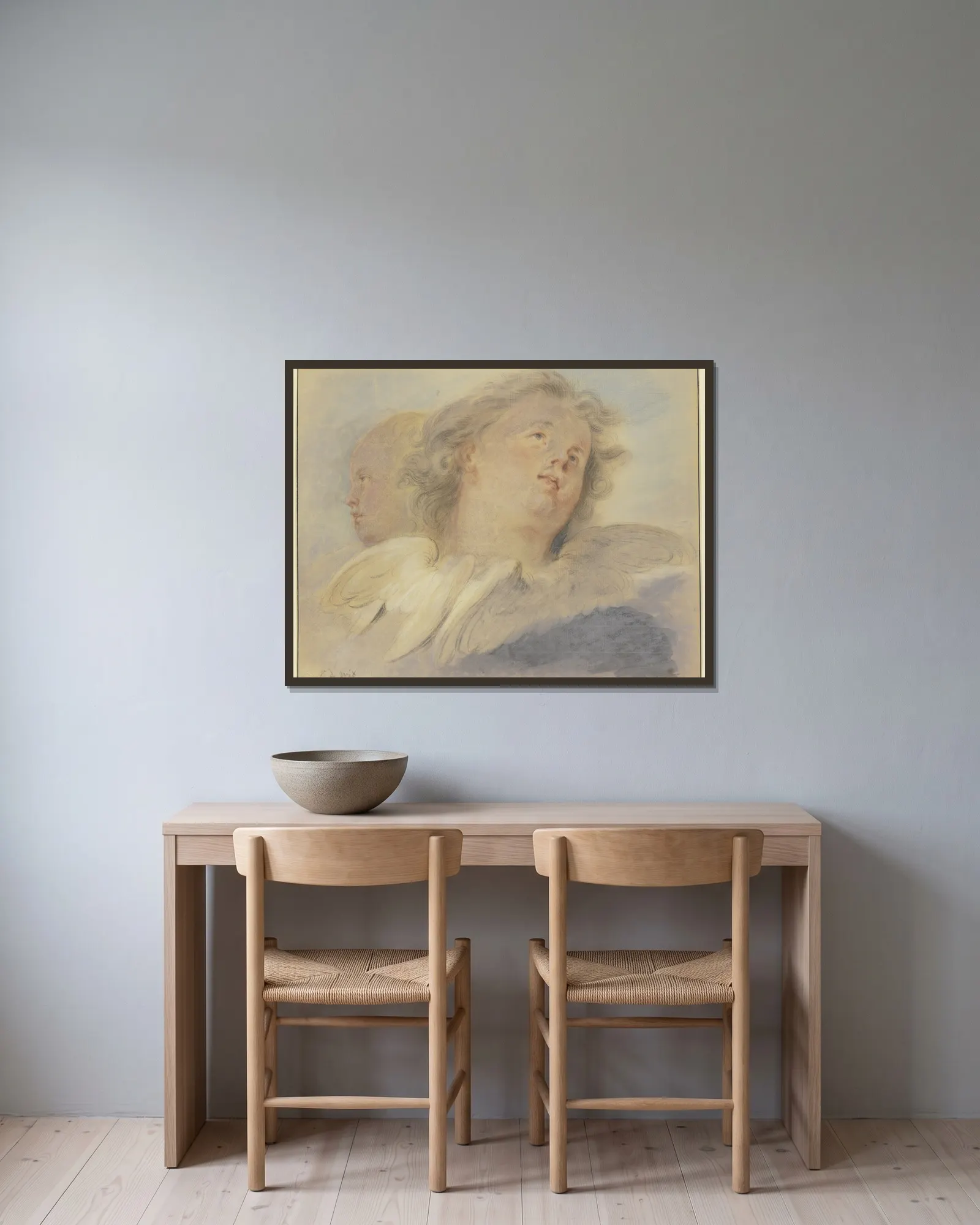 Two angel heads, av Jacob de Wit inramad på en vägg