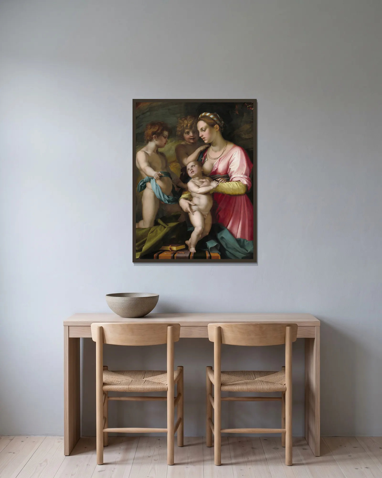 Charity av Andrea del Sarto inramad på en vägg