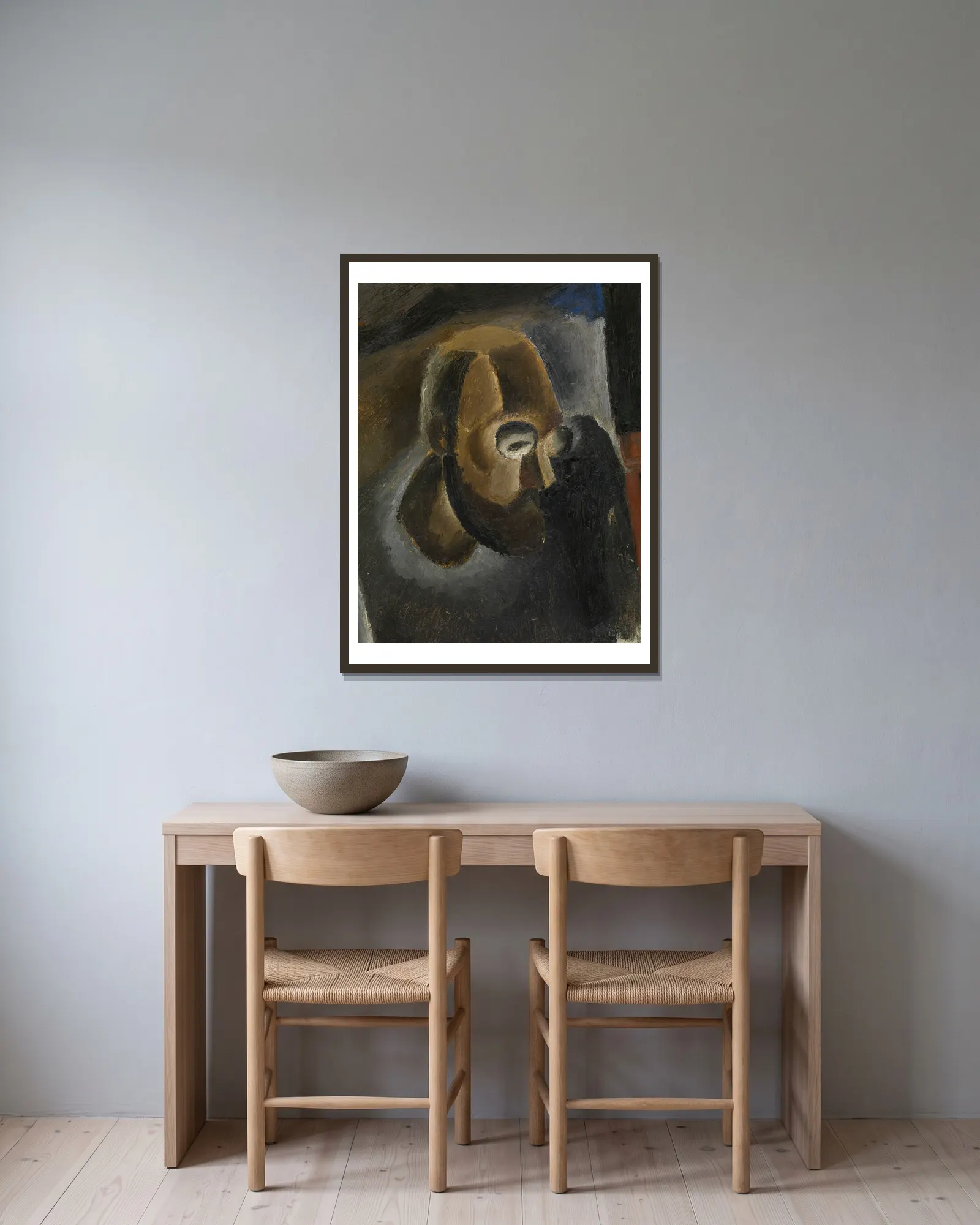 Selfportrait av Frits van den Berghe inramad på en vägg