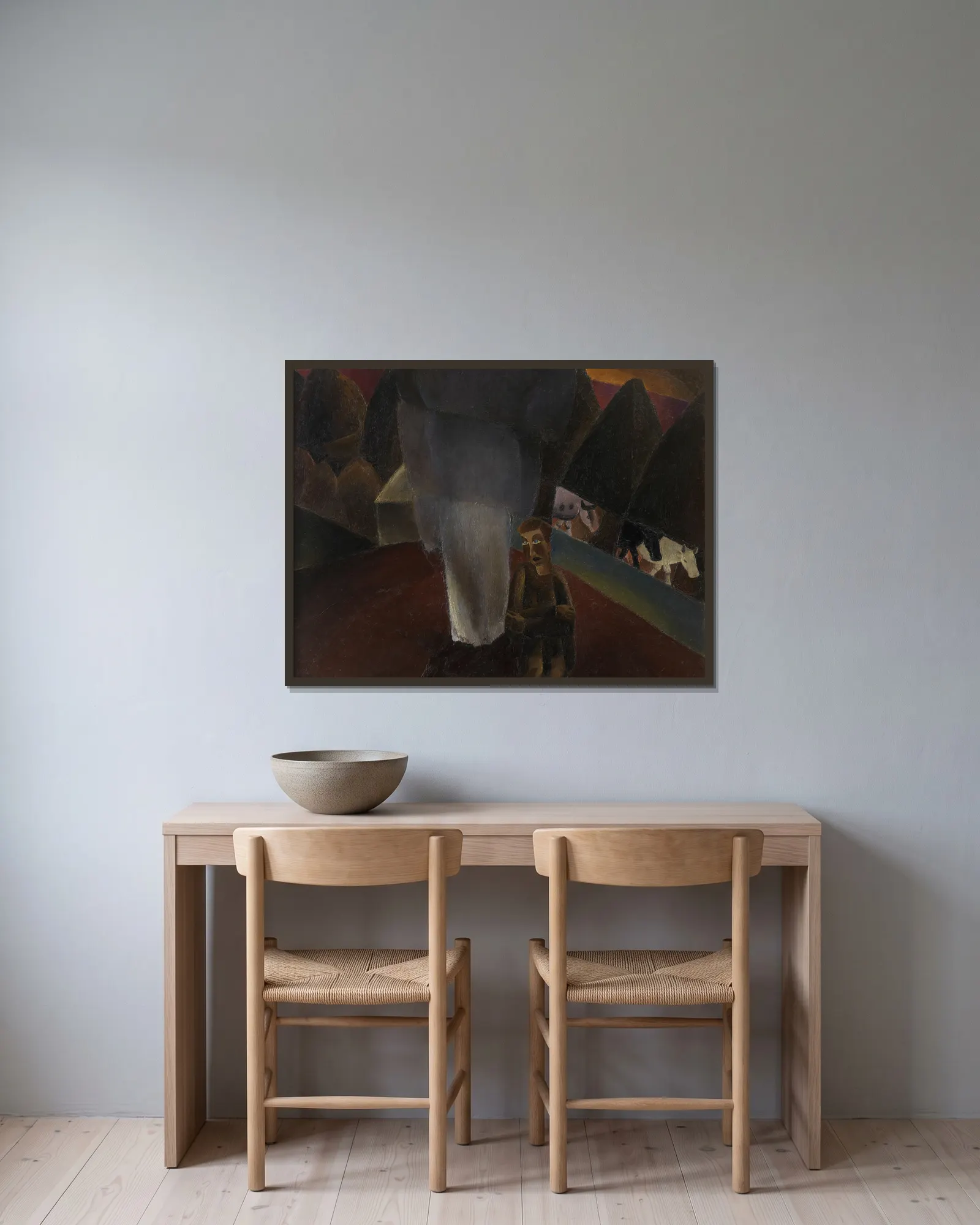 The Cowherd av Frits van den Berghe inramad på en vägg