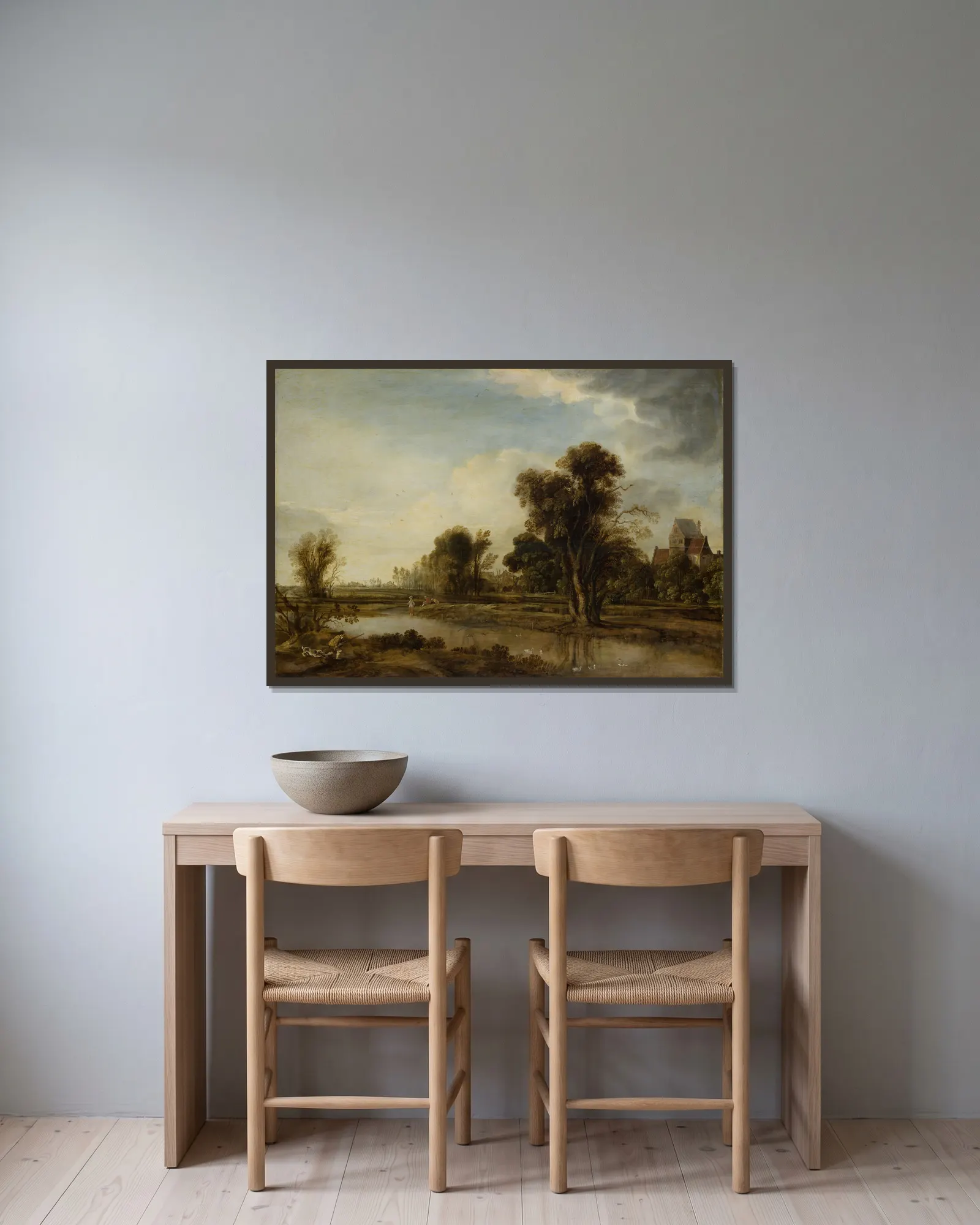 Village Pond av Aert van der Neer inramad på en vägg