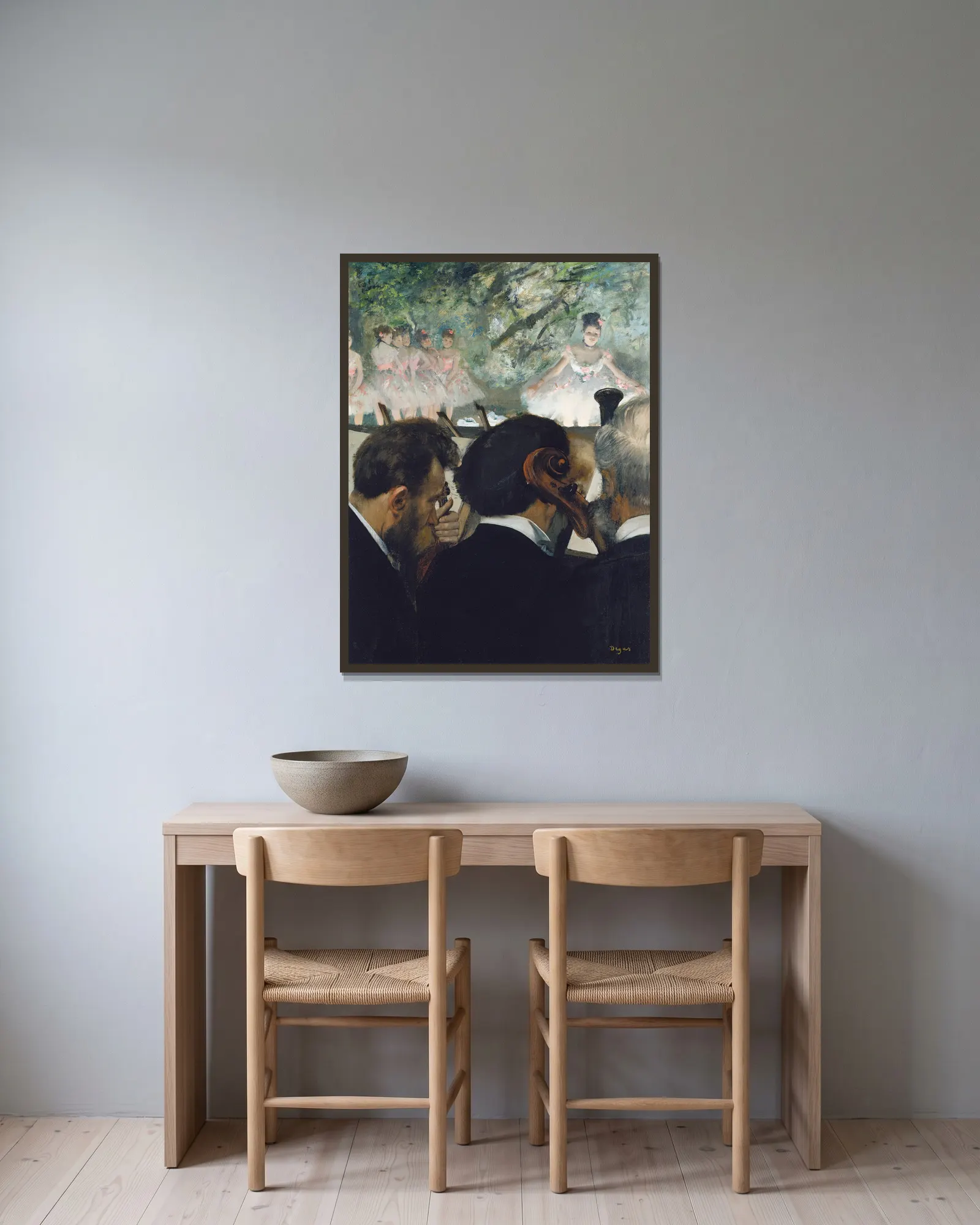 Orchestra Musicians av Edgar Degas inramad på en vägg