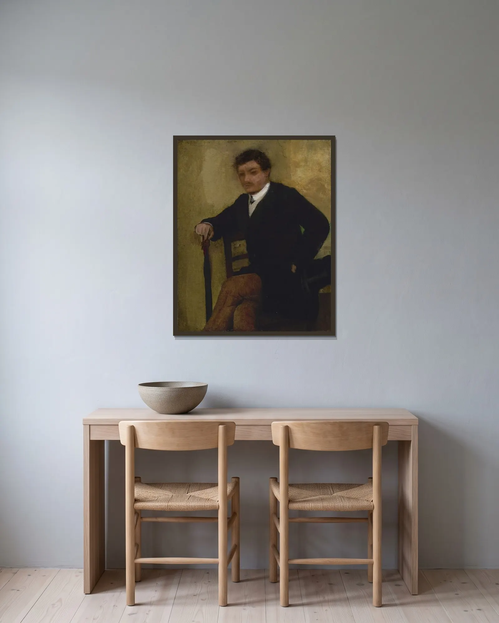 Portrait d’homme assis av Edgar Degas inramad på en vägg