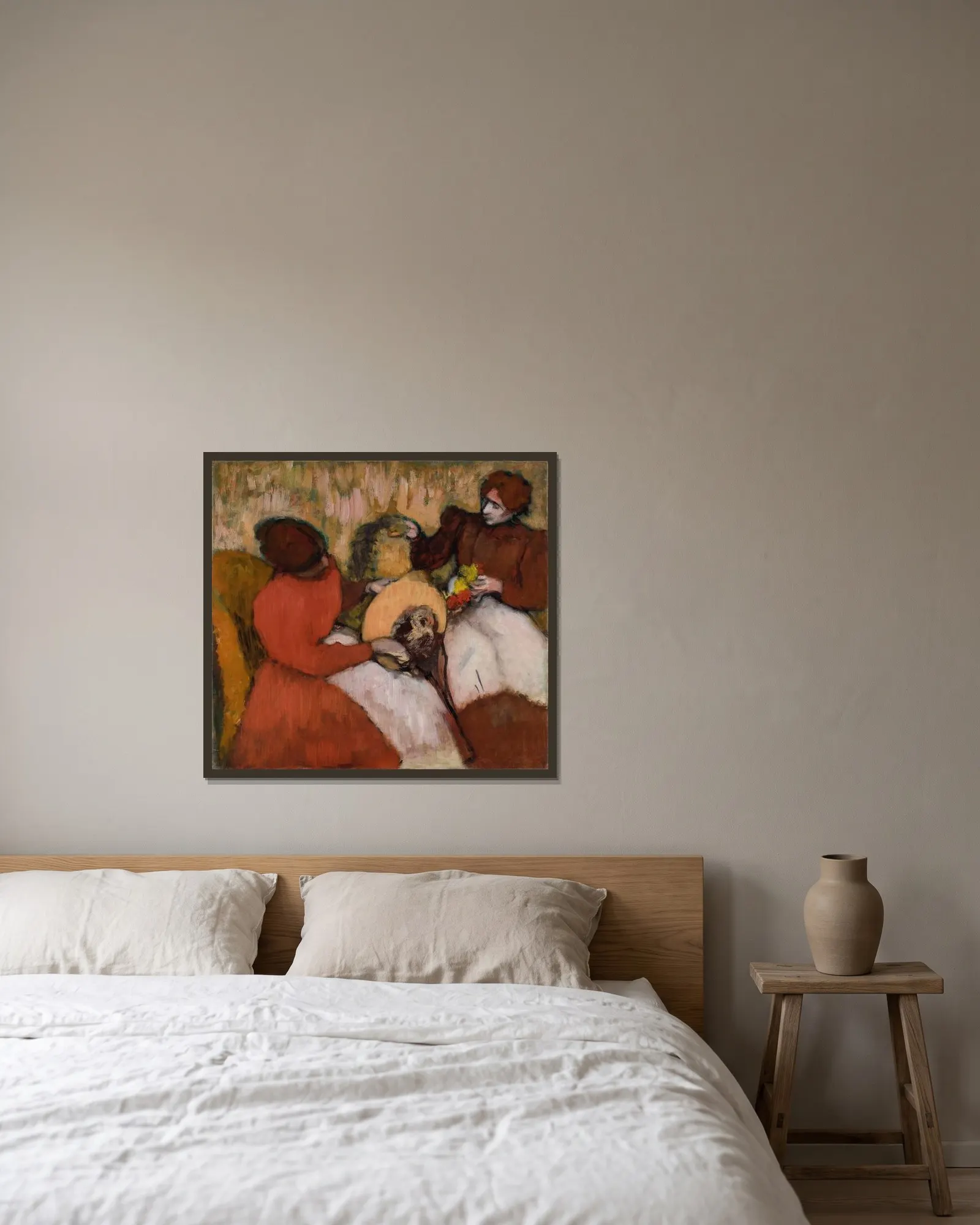The Milliners av Edgar Degas inramad på en vägg