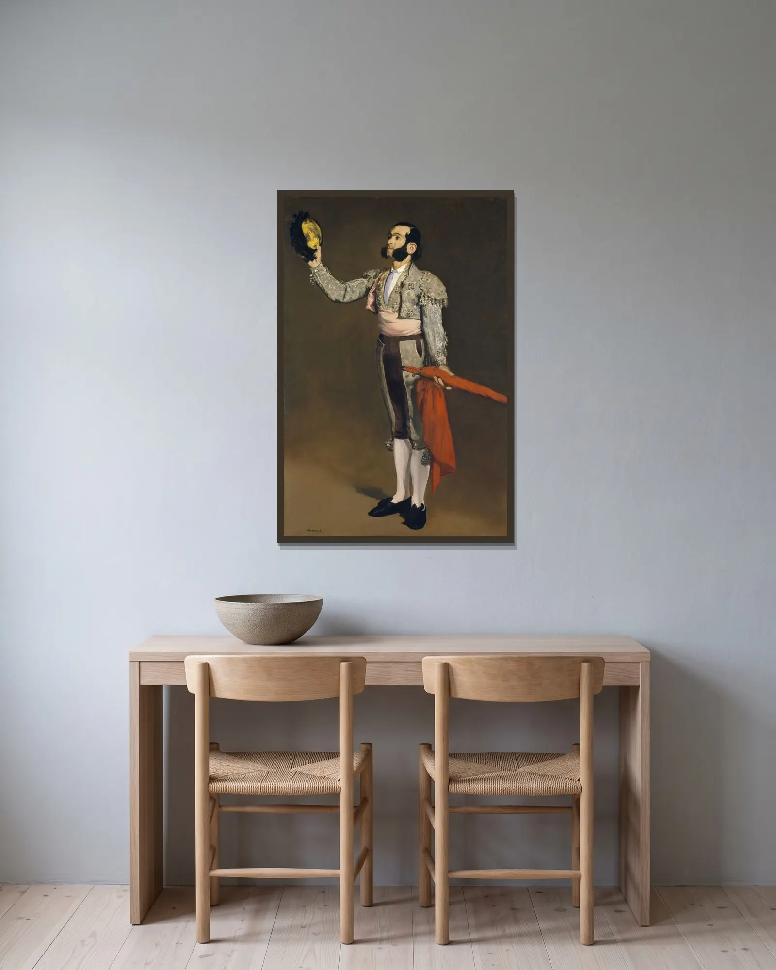 A Matador av Édouard Manet inramad på en vägg