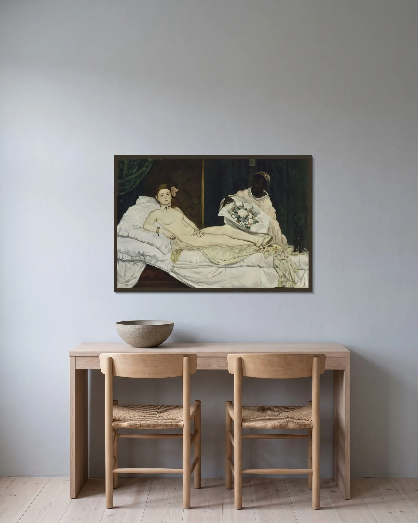Olympia av Édouard Manet inramad på en vägg