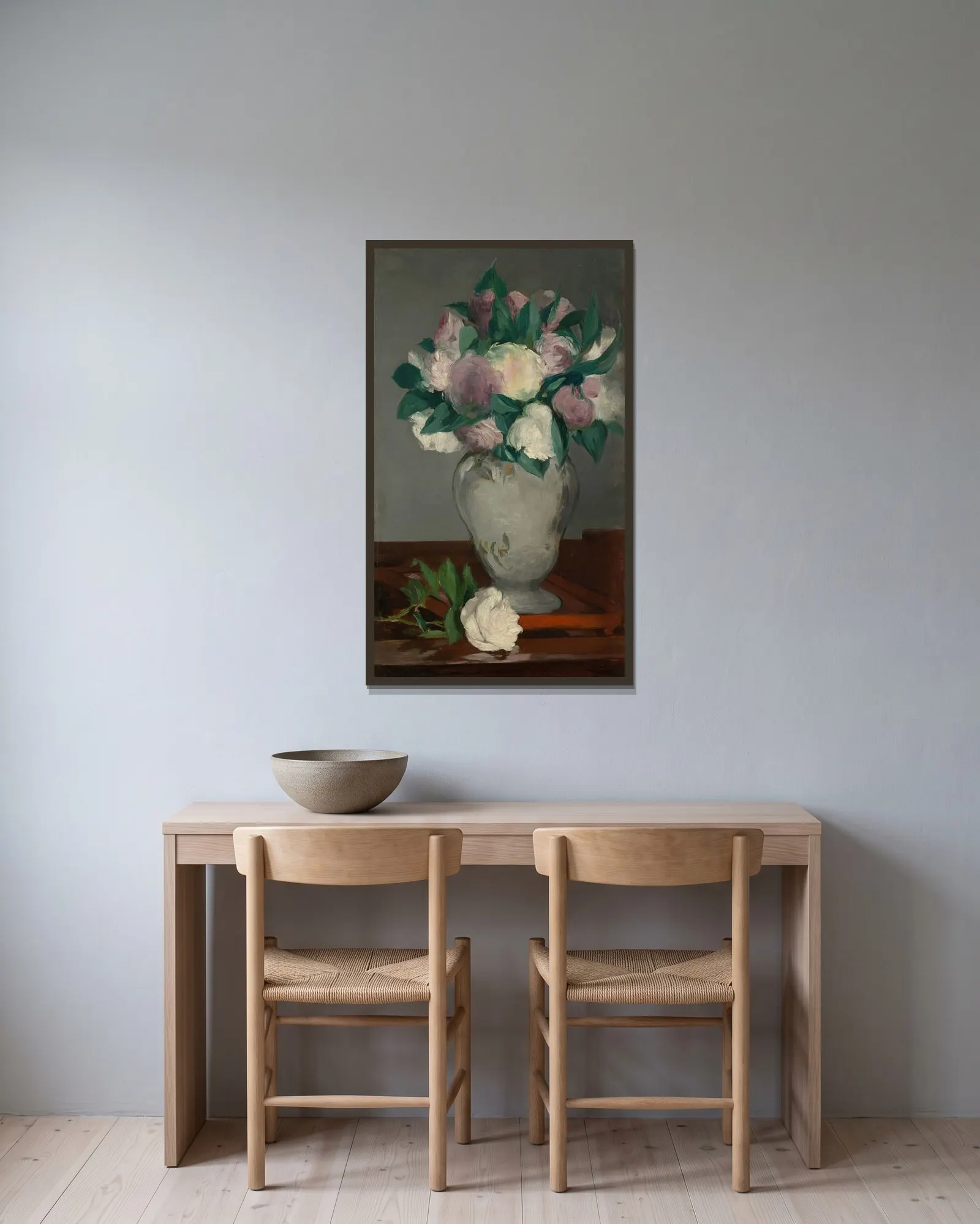 Peonies av Édouard Manet inramad på en vägg